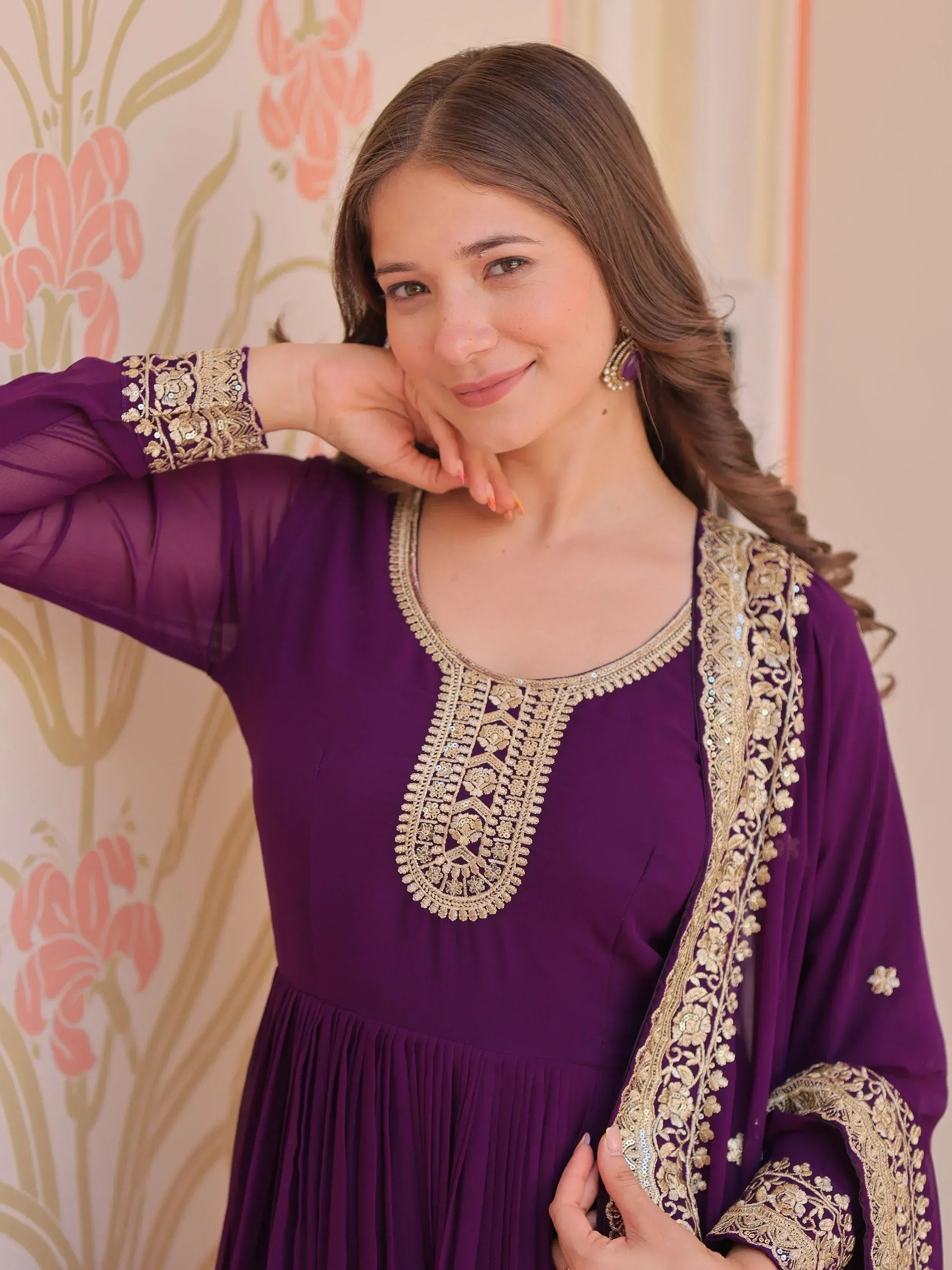 Purple ethnic gown with gold embroidery, perfect for Indian occasions and festive wear.