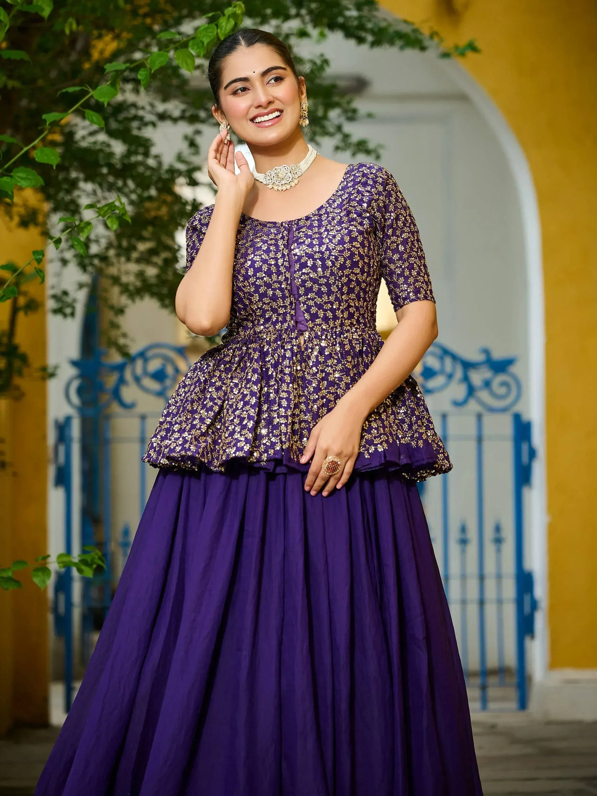 Purple ethnic gown with gold embroidery, perfect for Indian weddings and festive occasions