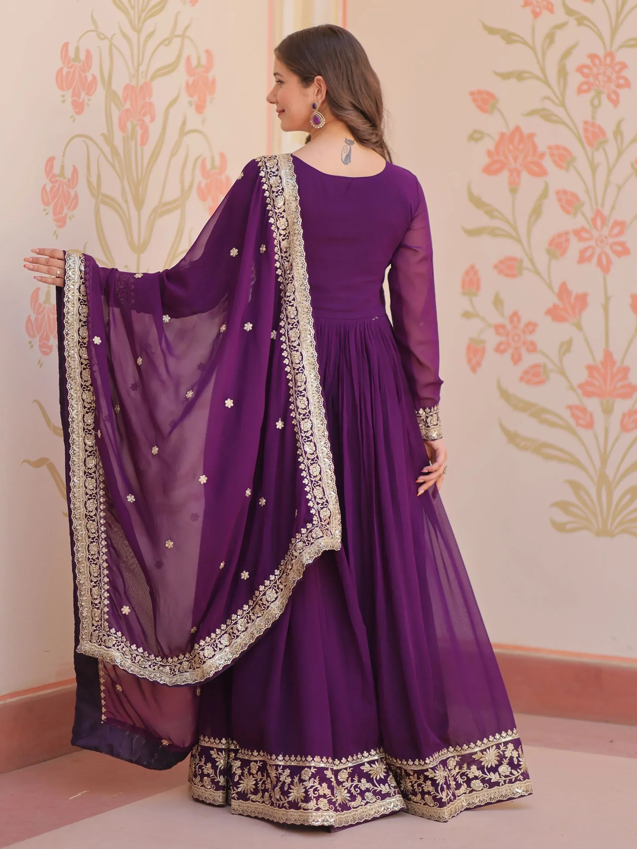 Purple ethnic anarkali suit with gold embroidery and dupatta, ideal for Indian weddings and festive occasions