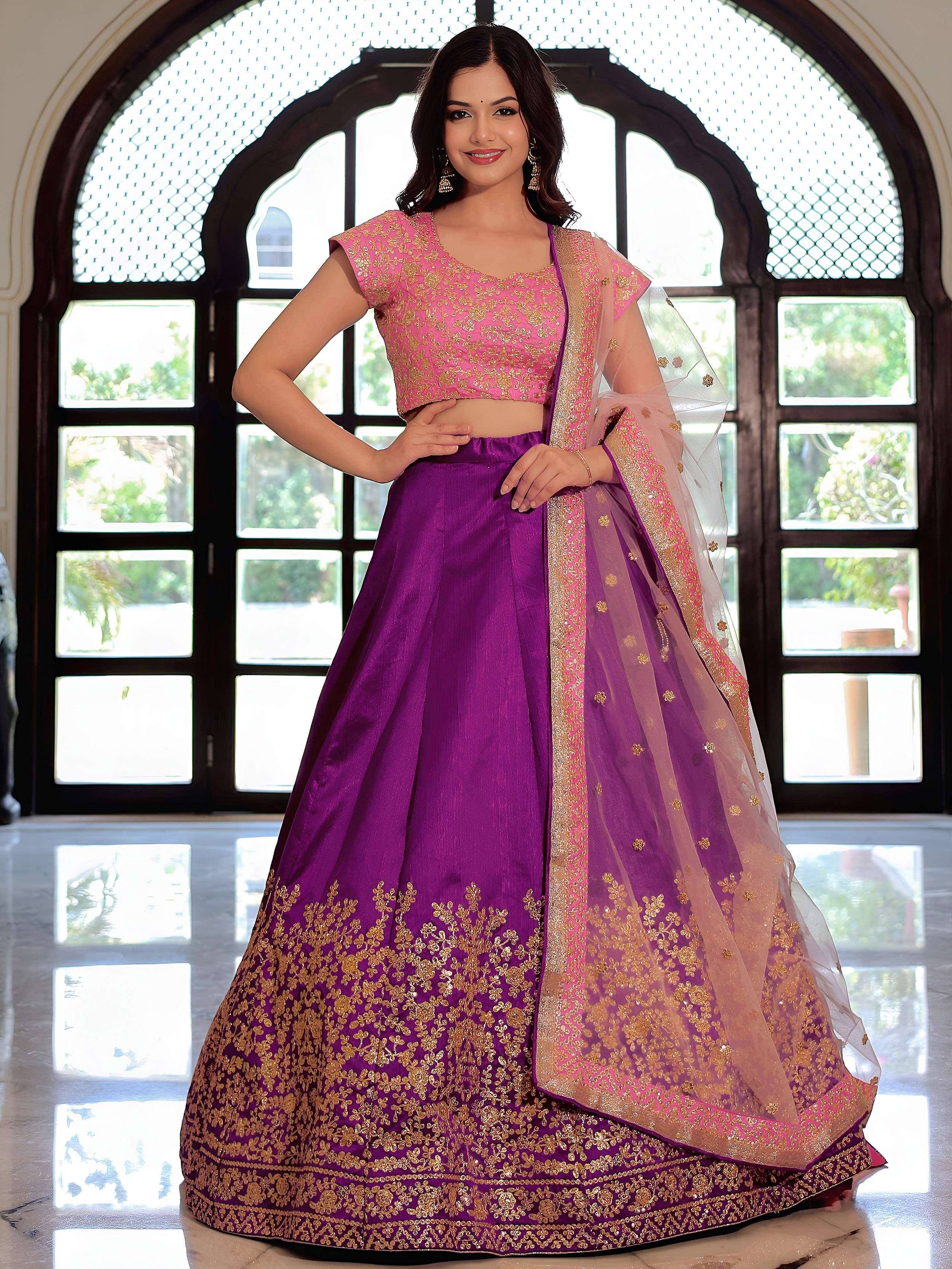 Purple and pink embroidered lehenga choli with gold detailing, perfect for Indian ethnic wear occasions.