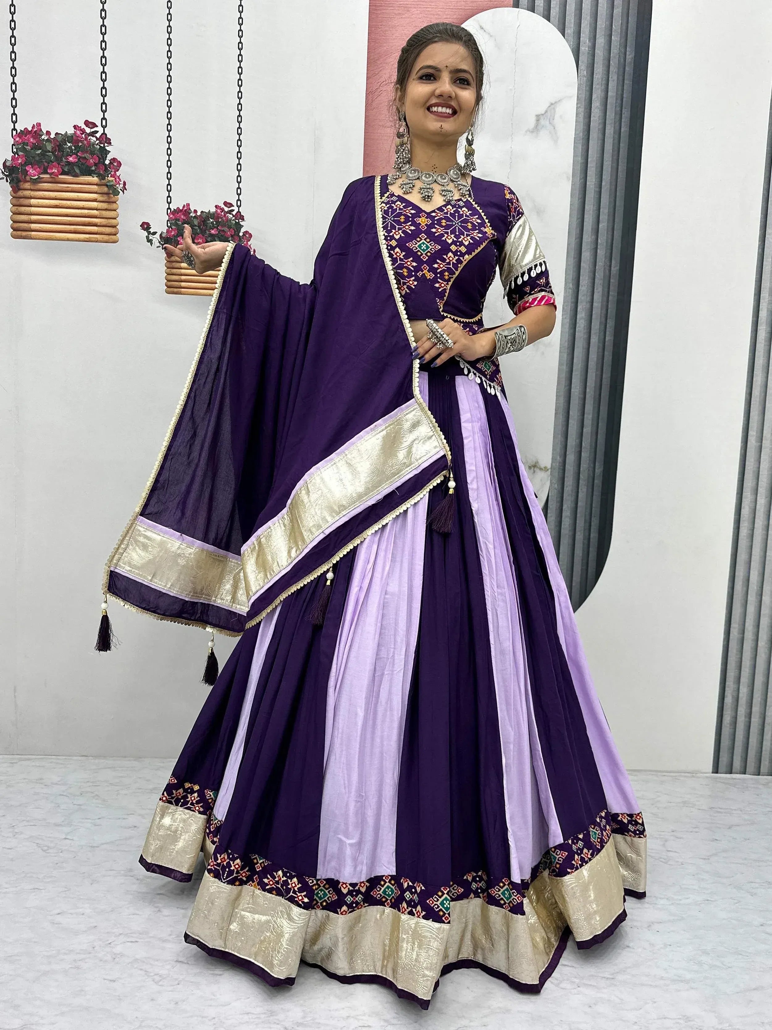 Purple and lavender embroidered lehenga choli with gold border, perfect for Indian ethnic wear occasions