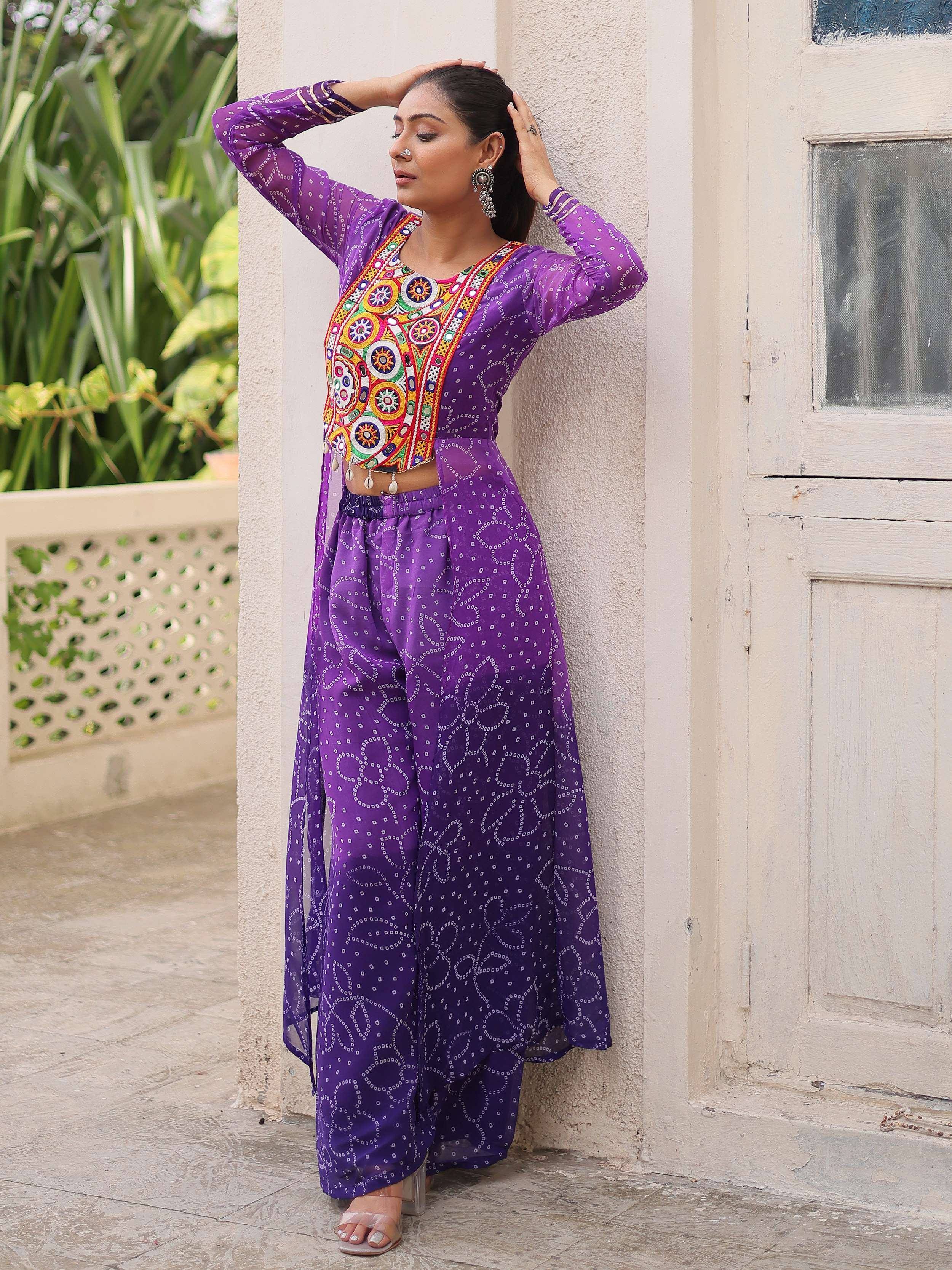 Purple ethnic wear with colorful embroidery, featuring a designer top and palazzo pants.