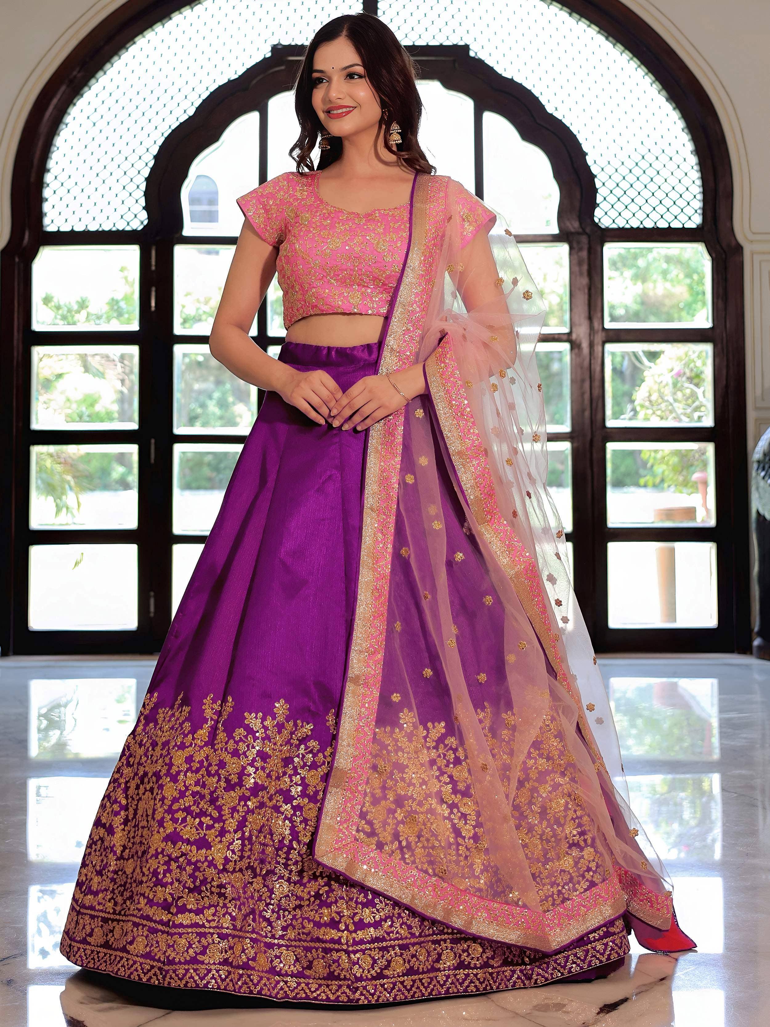 Purple and pink designer lehenga choli with gold embroidery, perfect for Indian weddings and festive occasions.