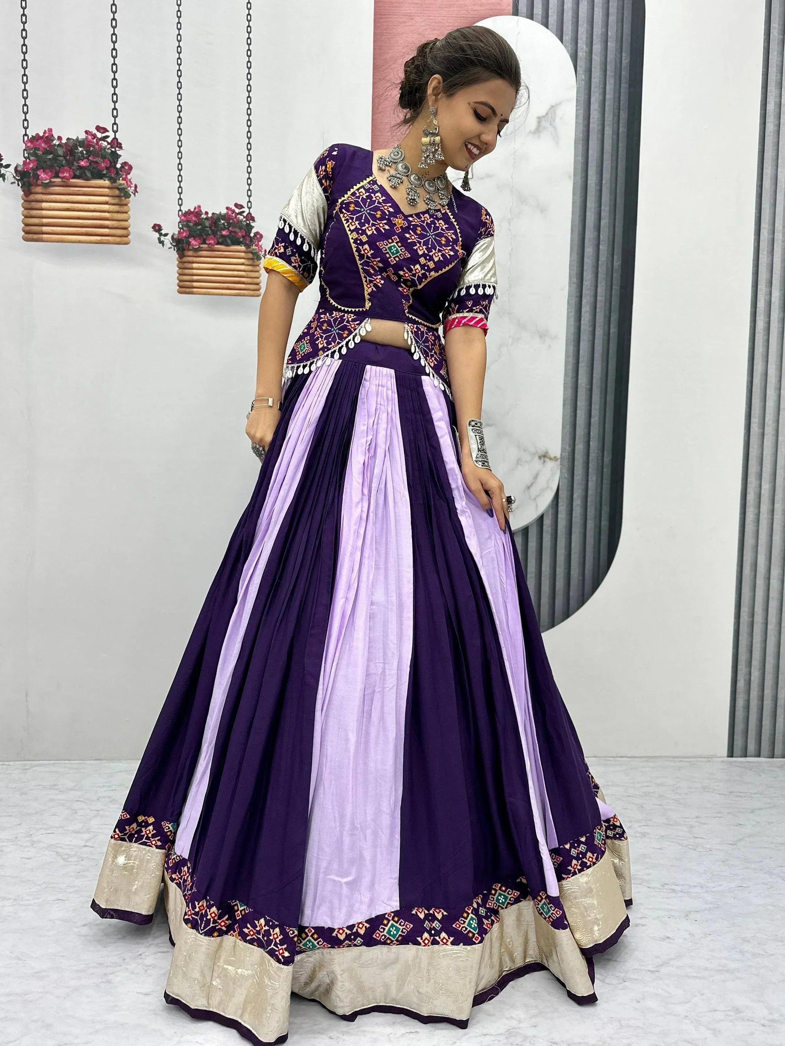Purple and lavender embroidered lehenga choli with mirror work, perfect for Indian ethnic wear occasions.