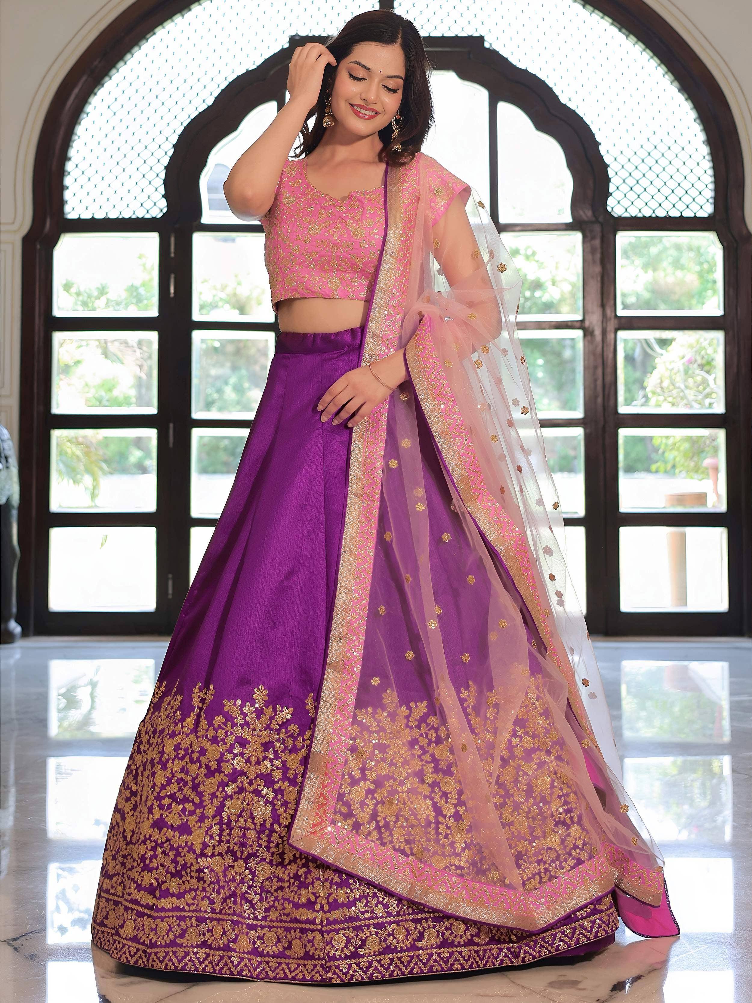 Pink and purple embroidered lehenga choli with gold detailing, perfect for Indian ethnic wear occasions.