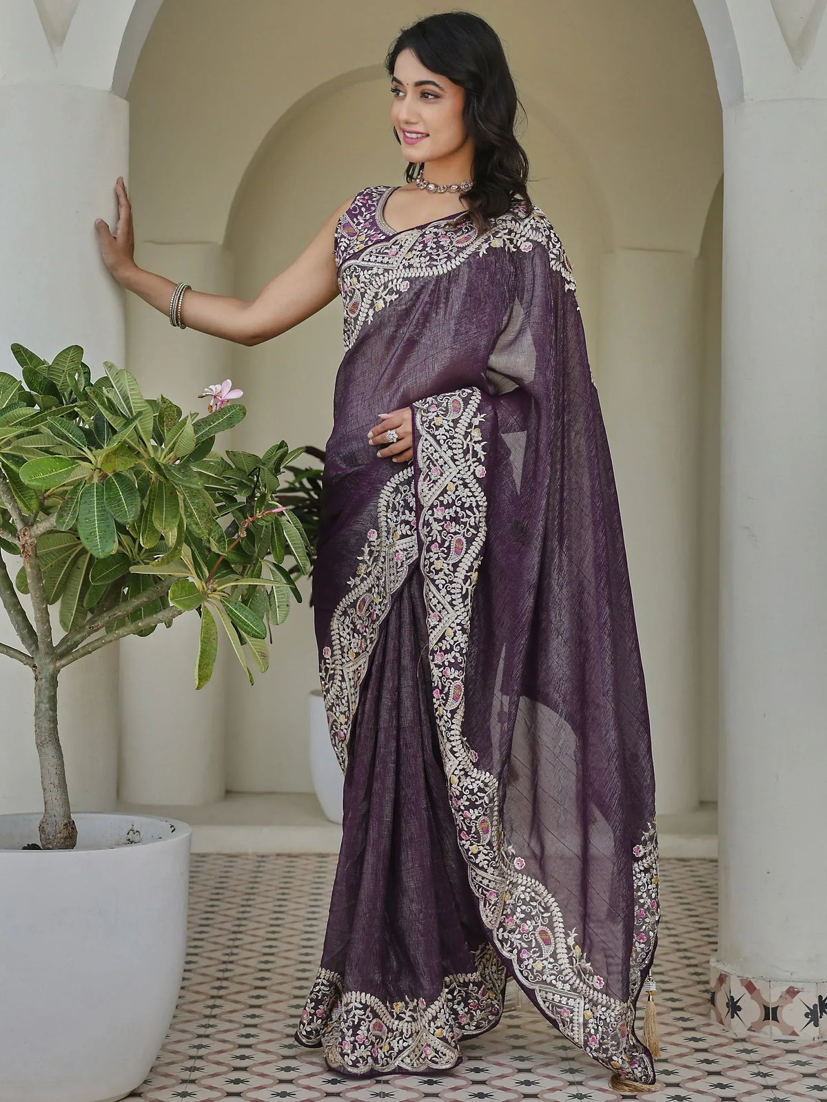 Purple embroidered saree with floral zari work, perfect for Indian ethnic occasions and weddings.