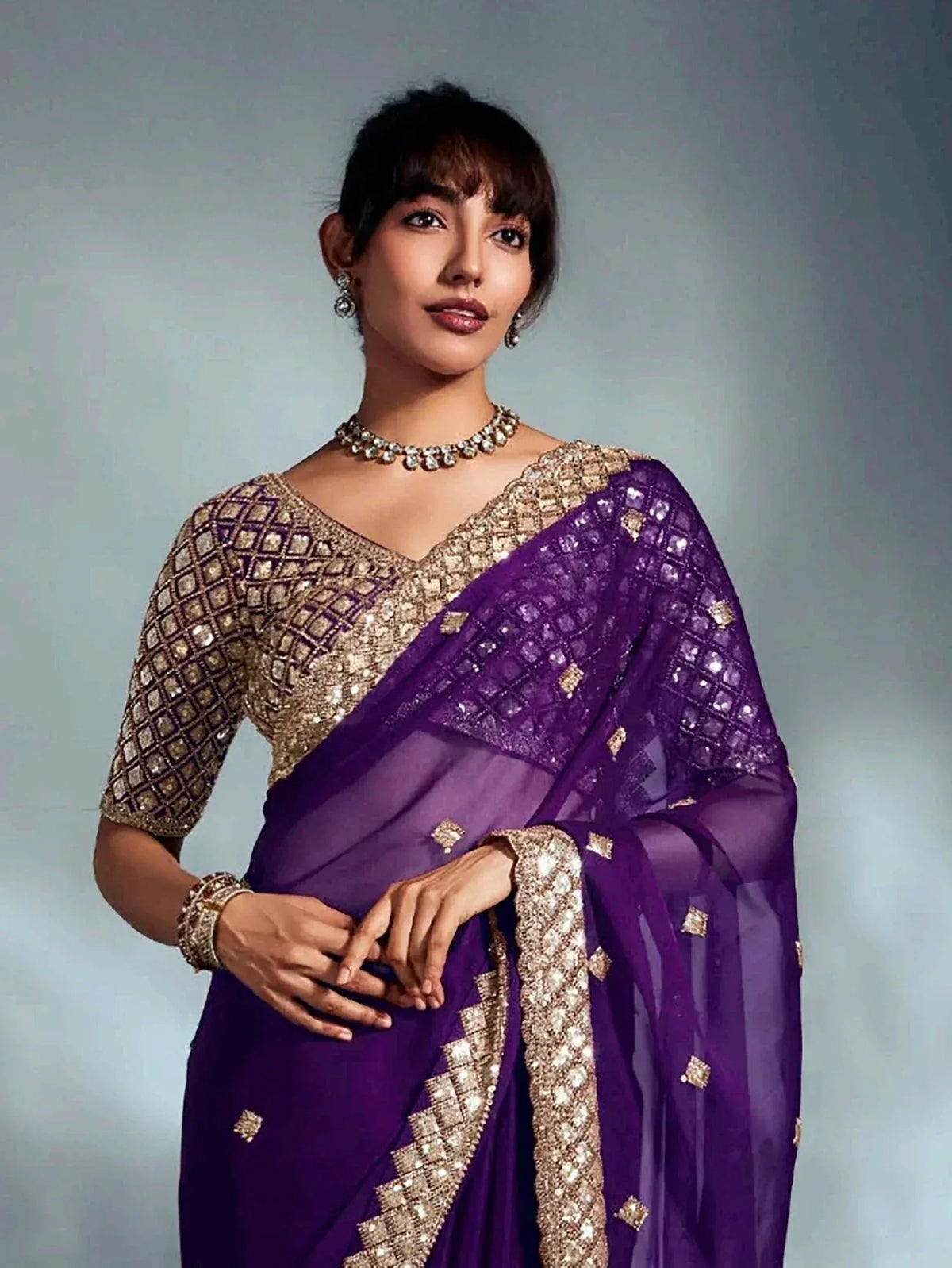 Purple designer saree with gold embroidery and sequin work, perfect for Indian ethnic occasions