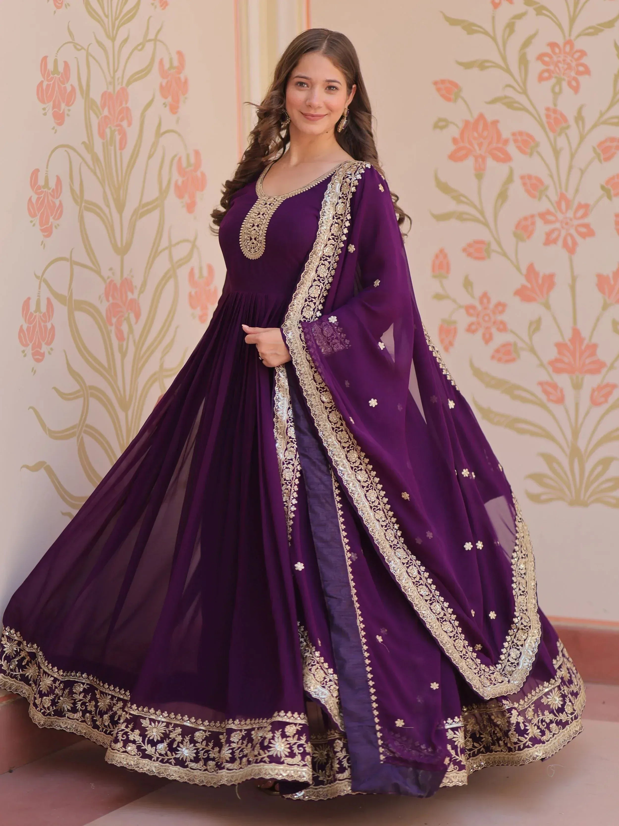 Purple Indian ethnic gown with gold embroidery, perfect for weddings and festive occasions