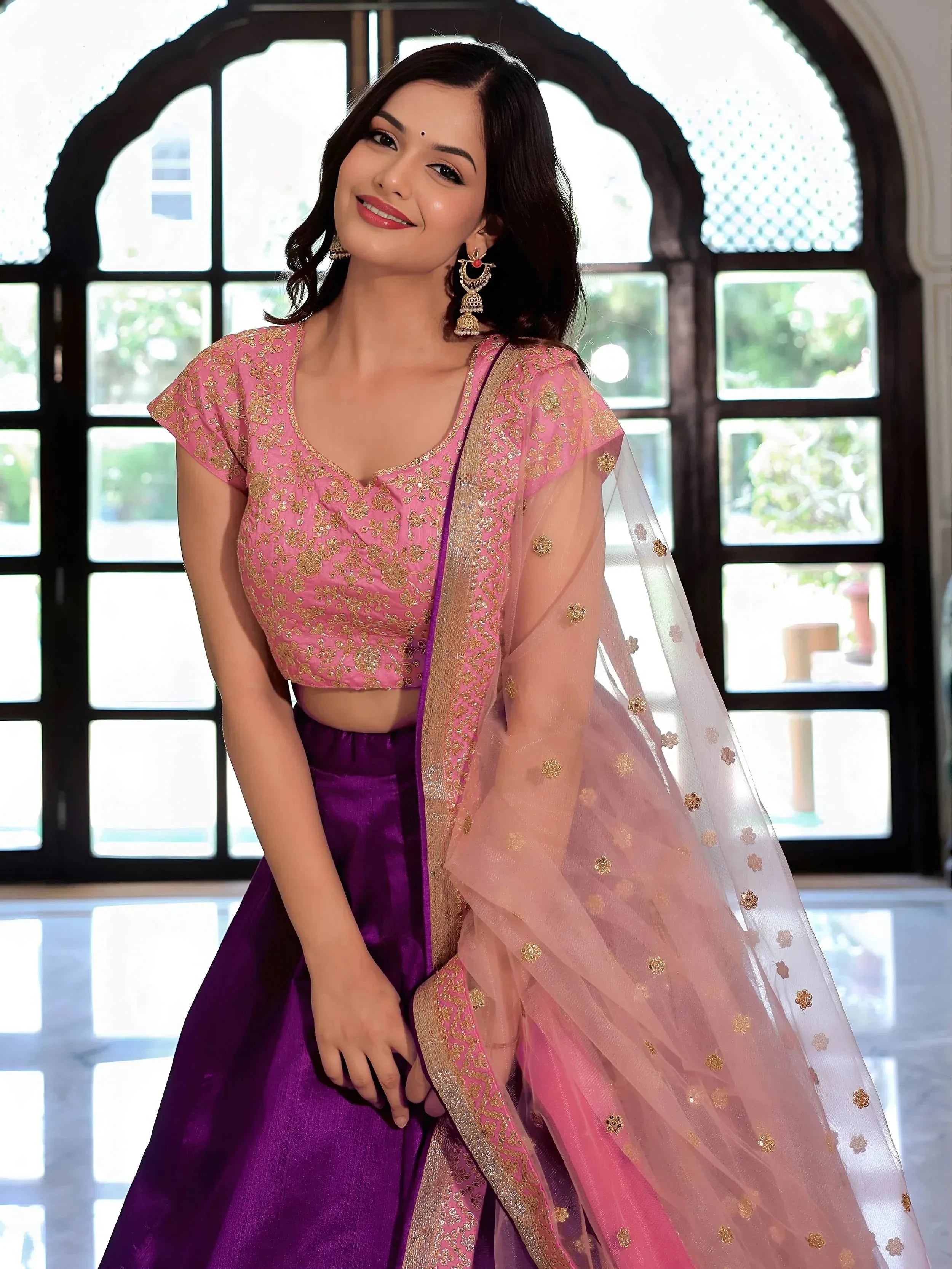 Pink and purple designer lehenga choli with gold embroidery and sheer dupatta, perfect for Indian ethnic wear