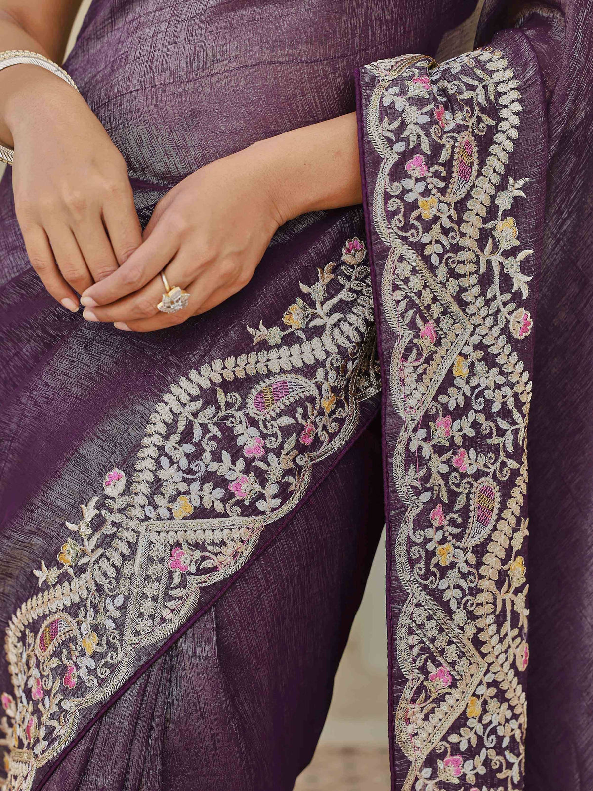 Purple saree with floral embroidery and intricate paisley designs, perfect for ethnic wear