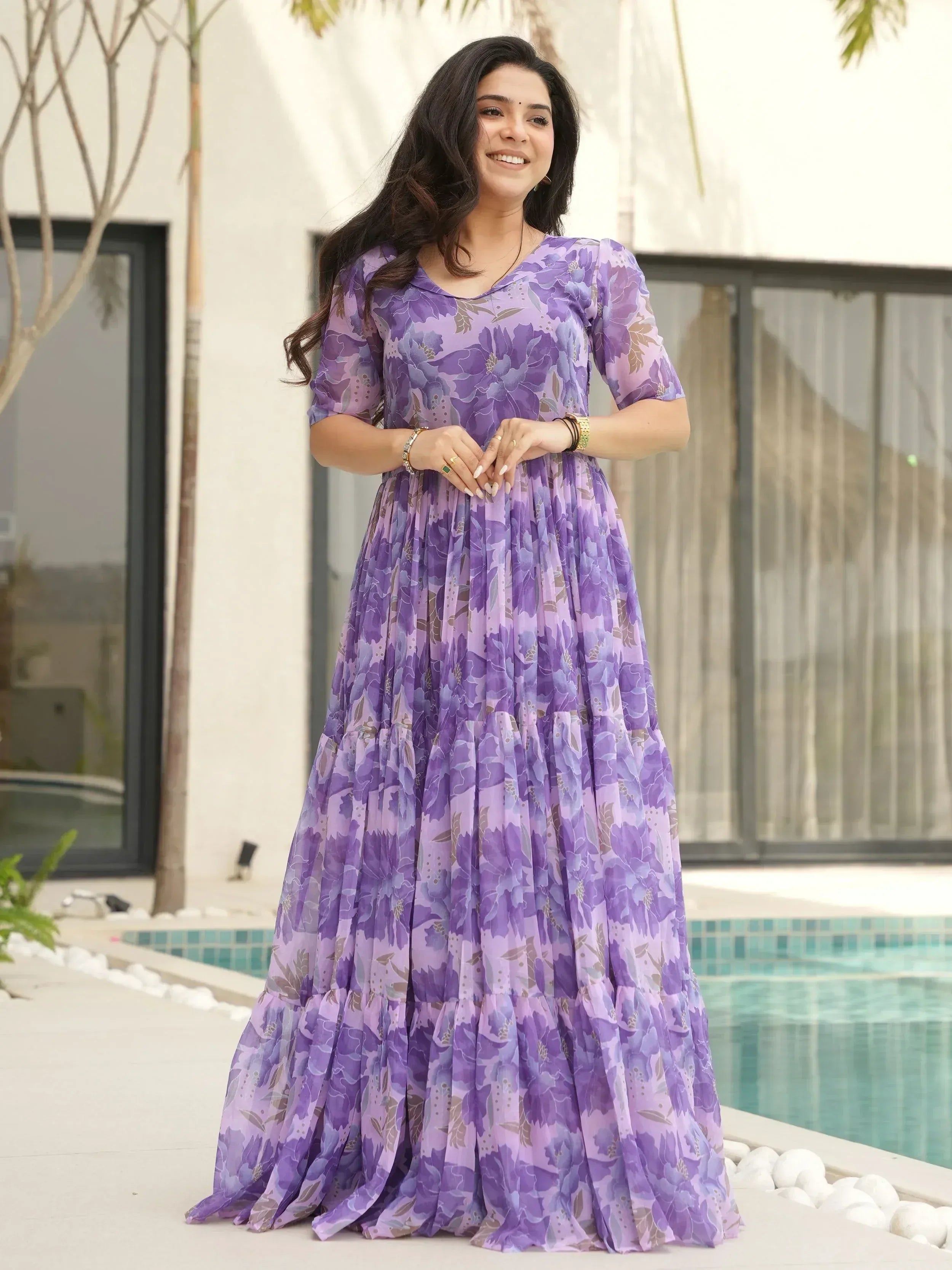 Purple floral ethnic gown with tiered skirt, perfect for festive occasions and parties