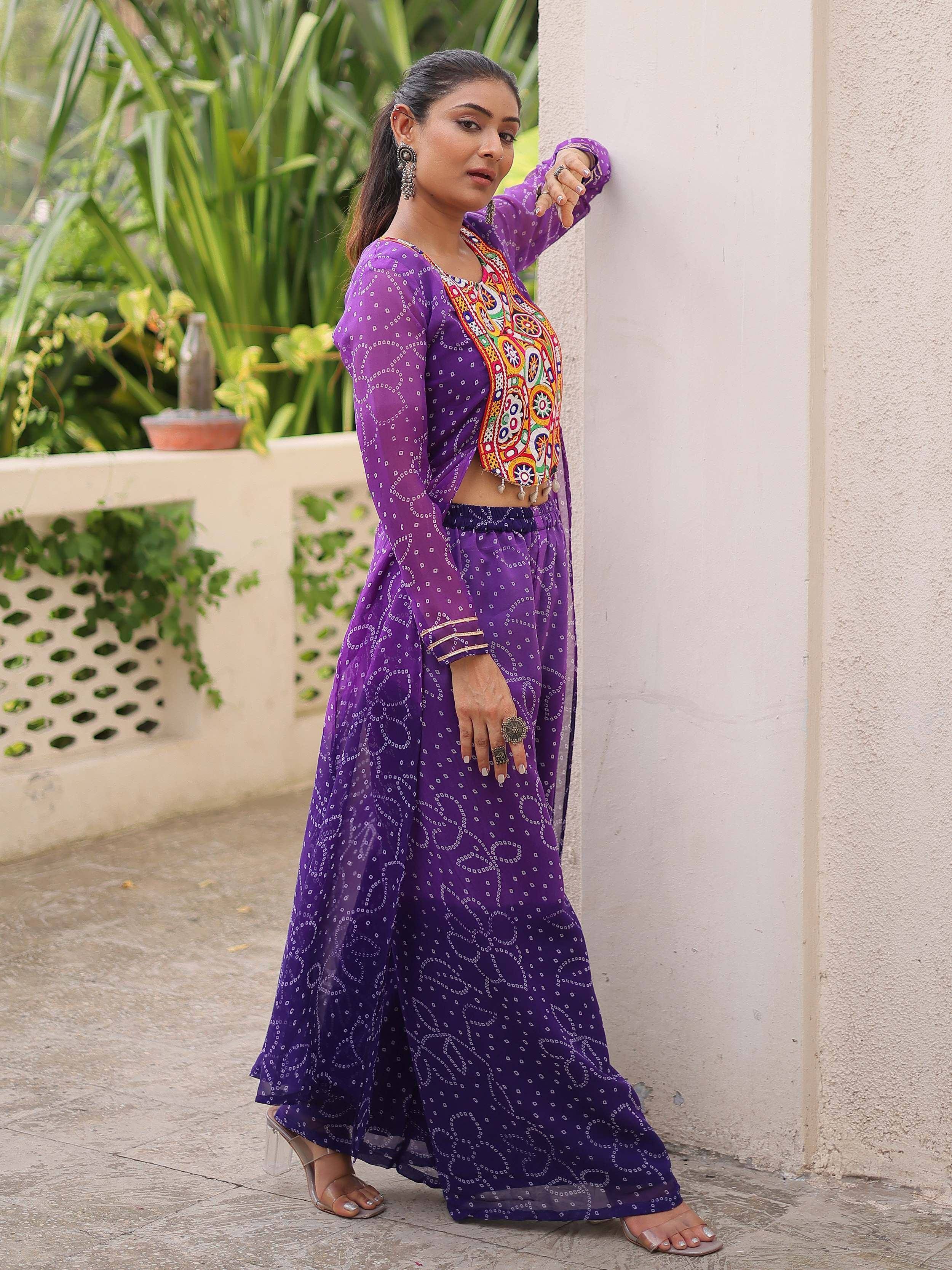 Purple ethnic gown with colorful embroidery, perfect for Indian festive wear