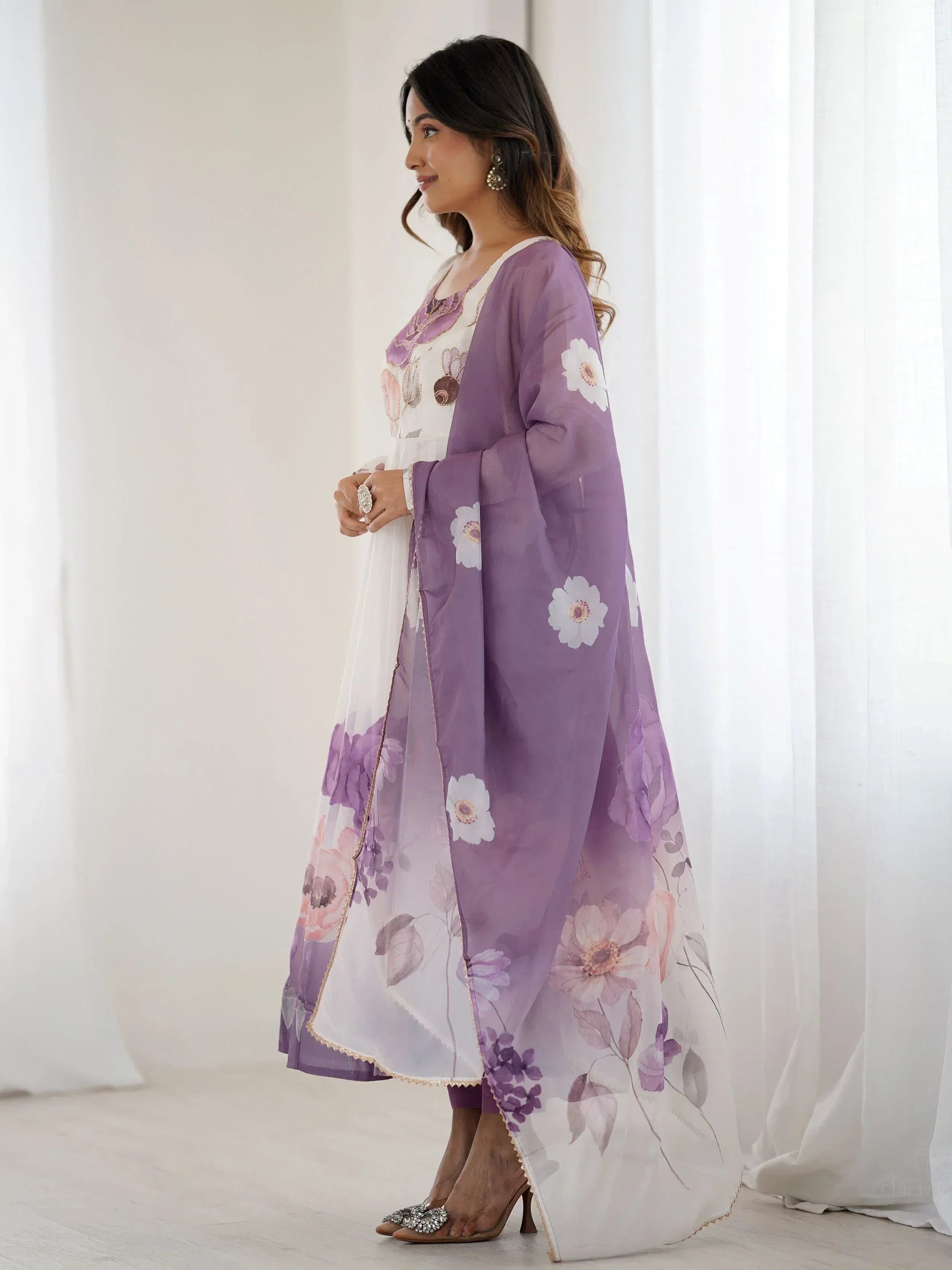 Purple floral printed ethnic gown with sheer overlay, perfect for Indian occasions and festive wear.