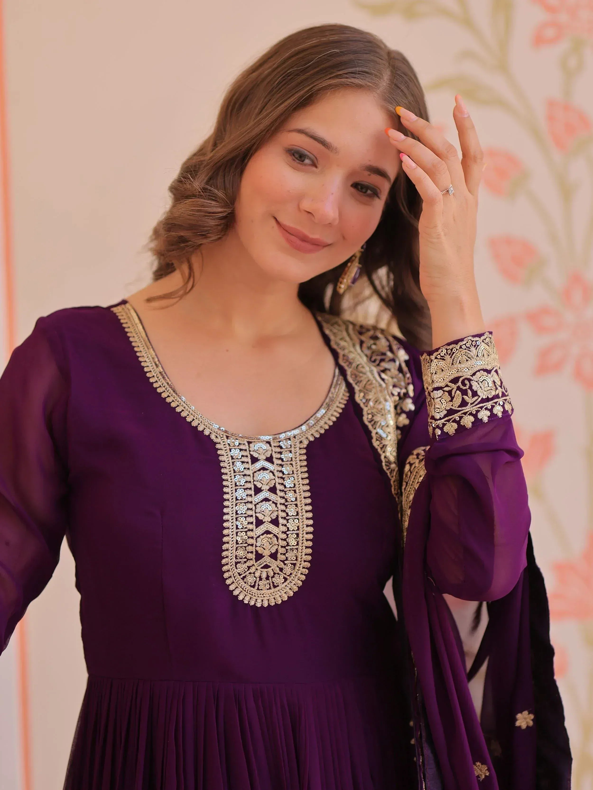 Purple ethnic gown with gold embroidery, perfect for Indian occasions and festive wear.