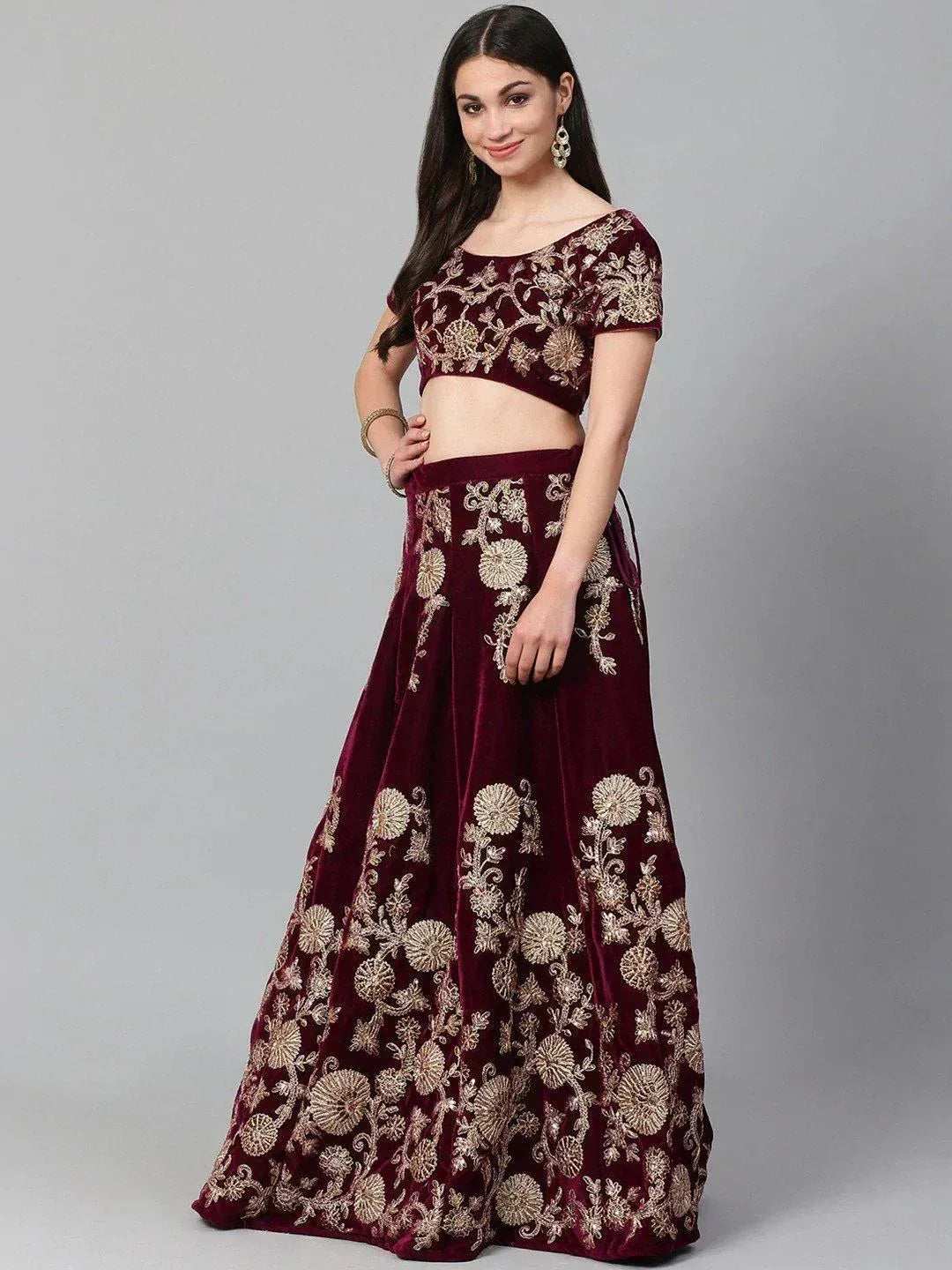 Maroon velvet lehenga choli with gold floral embroidery, perfect for Indian ethnic wear occasions