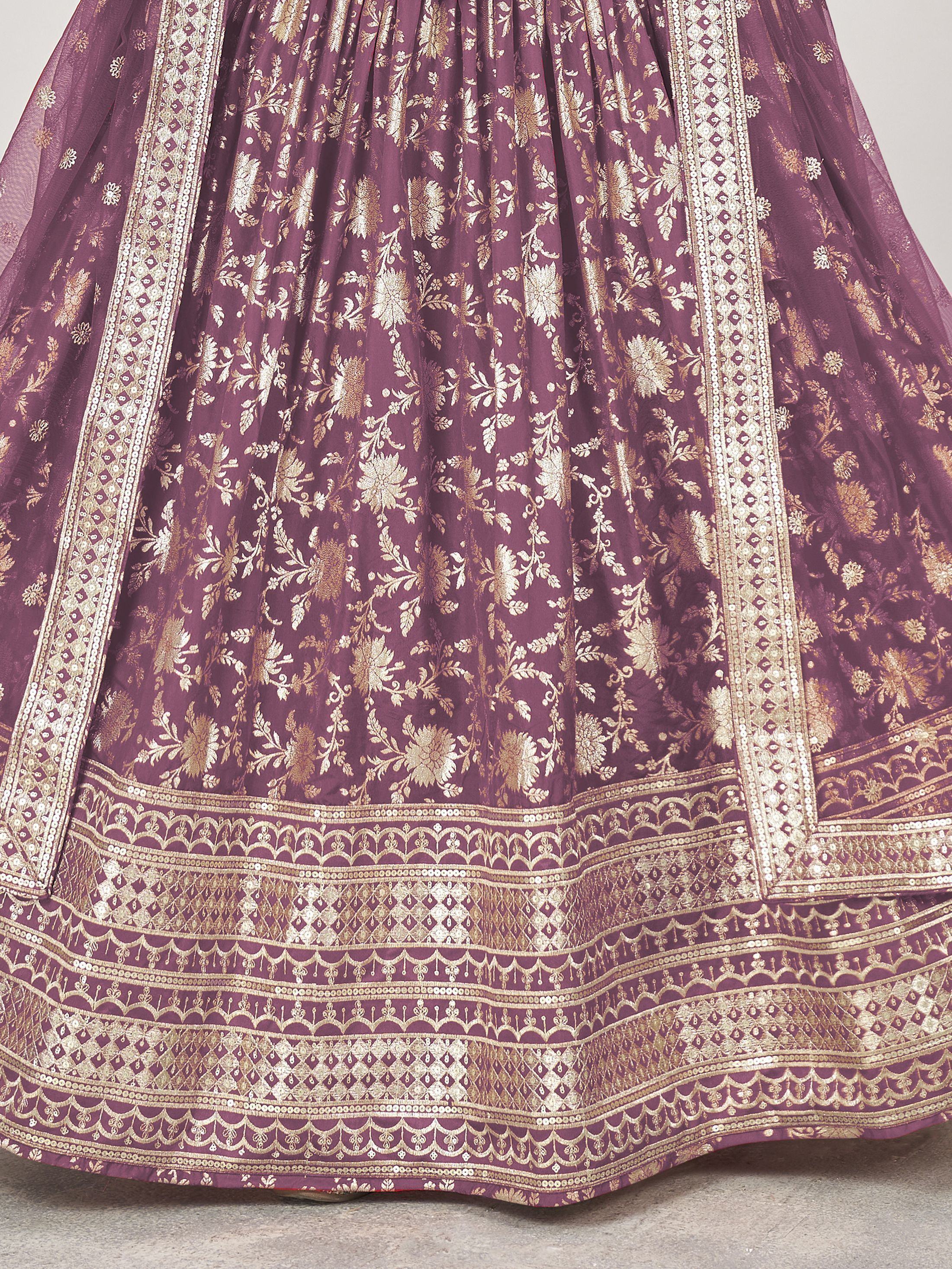 Purple lehenga with gold floral embroidery and intricate border detailing, ideal for Indian ethnic wear.