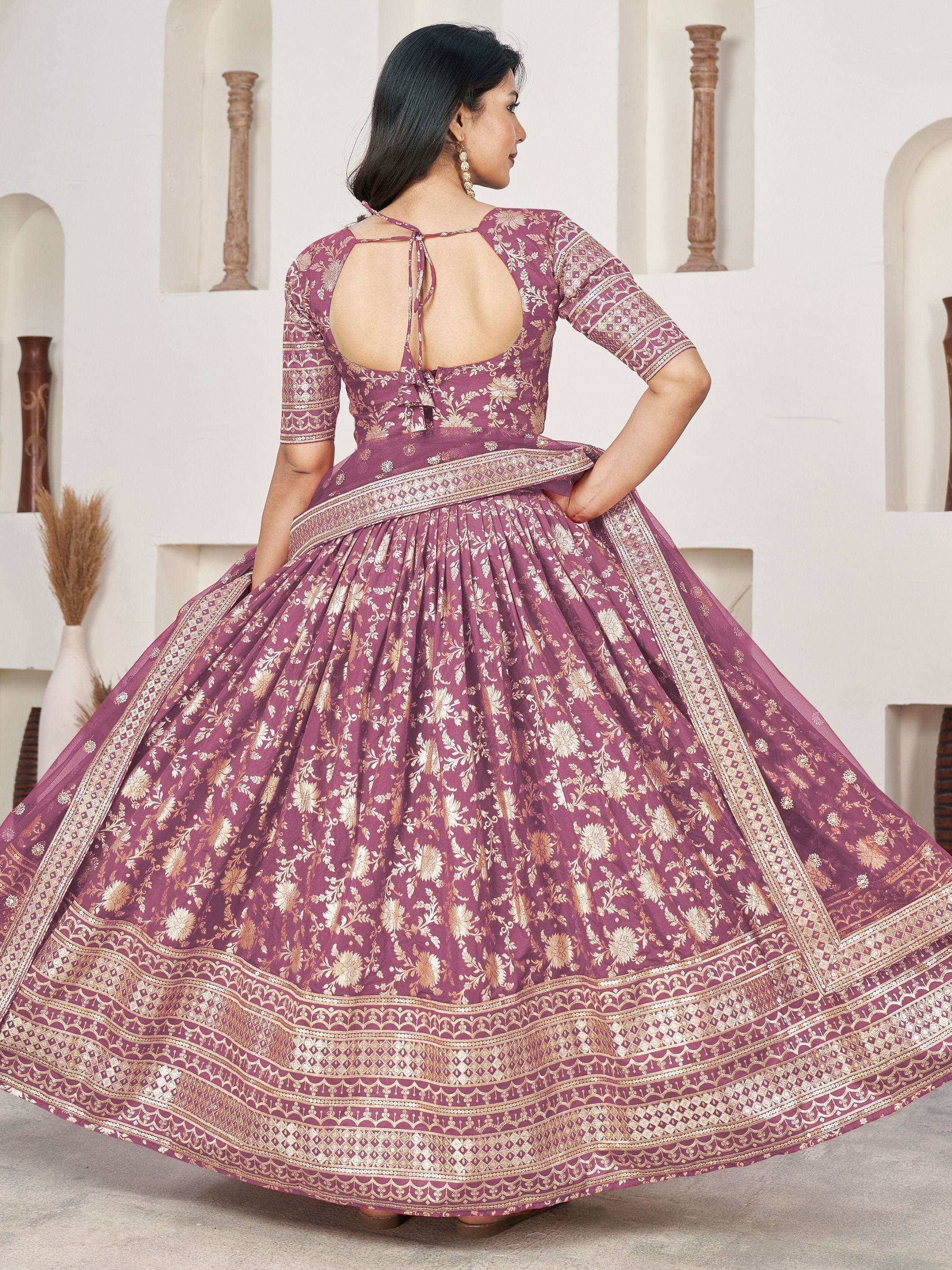 Elegant purple lehenga choli with gold floral print and open back, perfect for Indian ethnic wear
