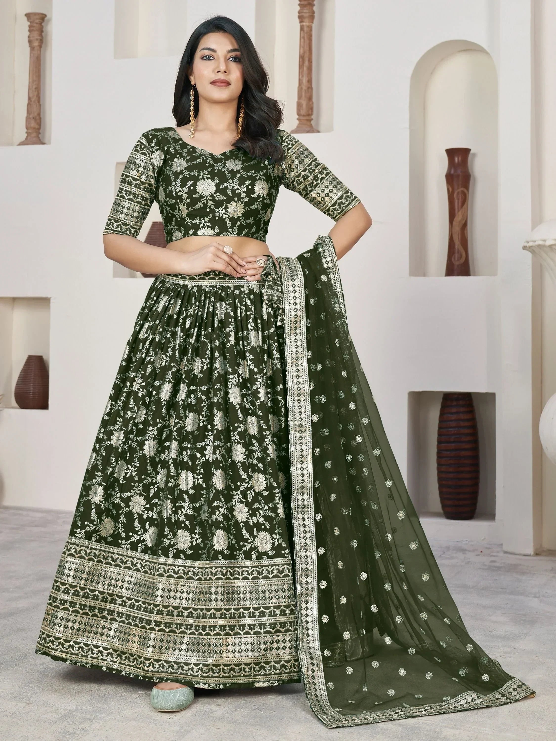 Olive green floral embroidered lehenga choli with gold detailing, perfect for Indian ethnic wear occasions.
