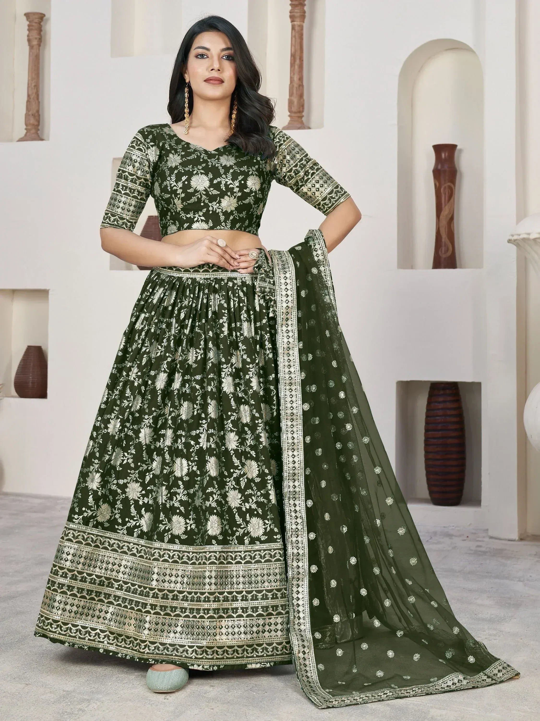 Olive green floral embroidered lehenga choli with gold detailing, perfect for Indian ethnic wear occasions.