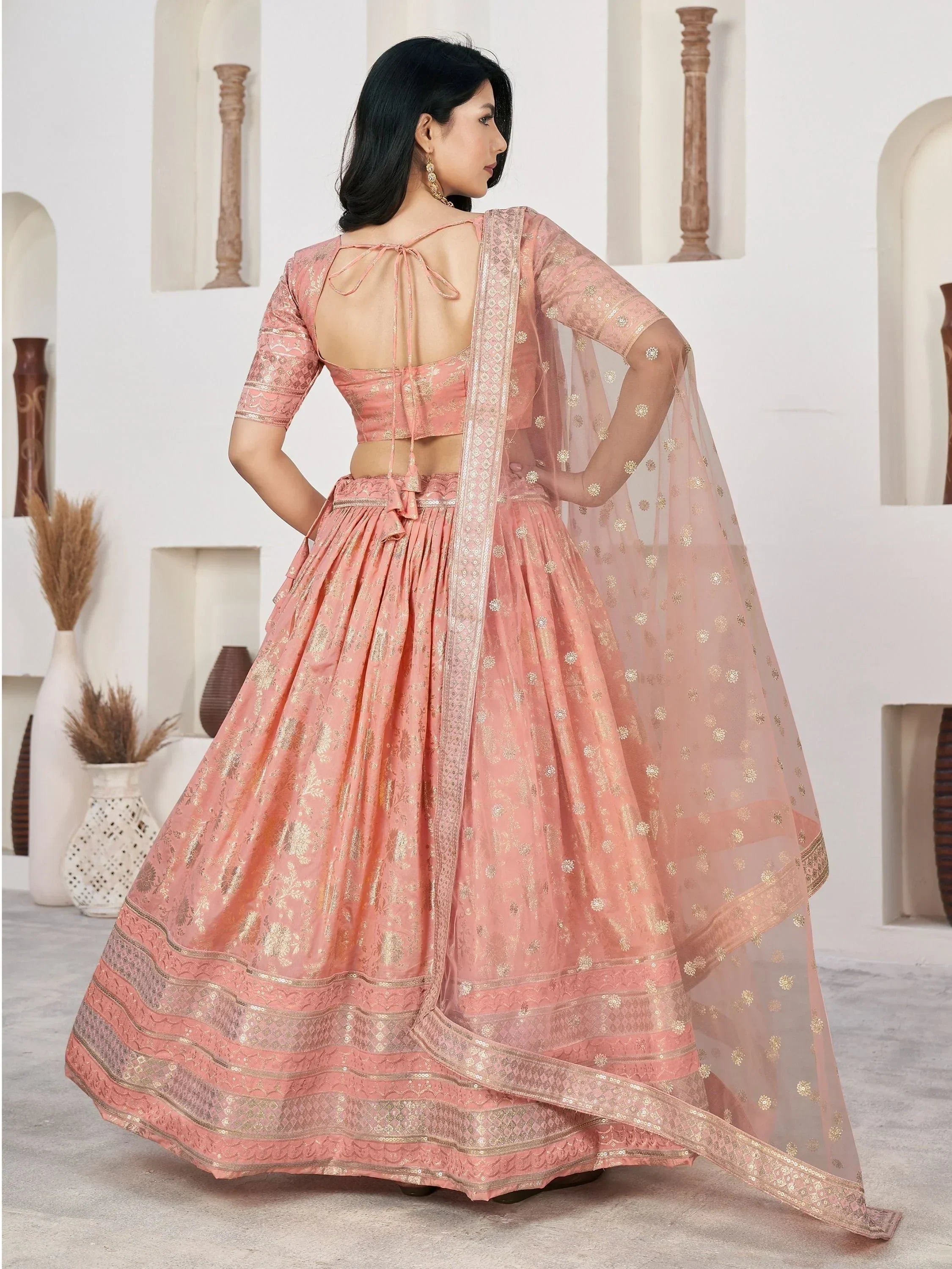 Pink designer lehenga choli with gold embroidery and sheer dupatta, ethnic Indian wear