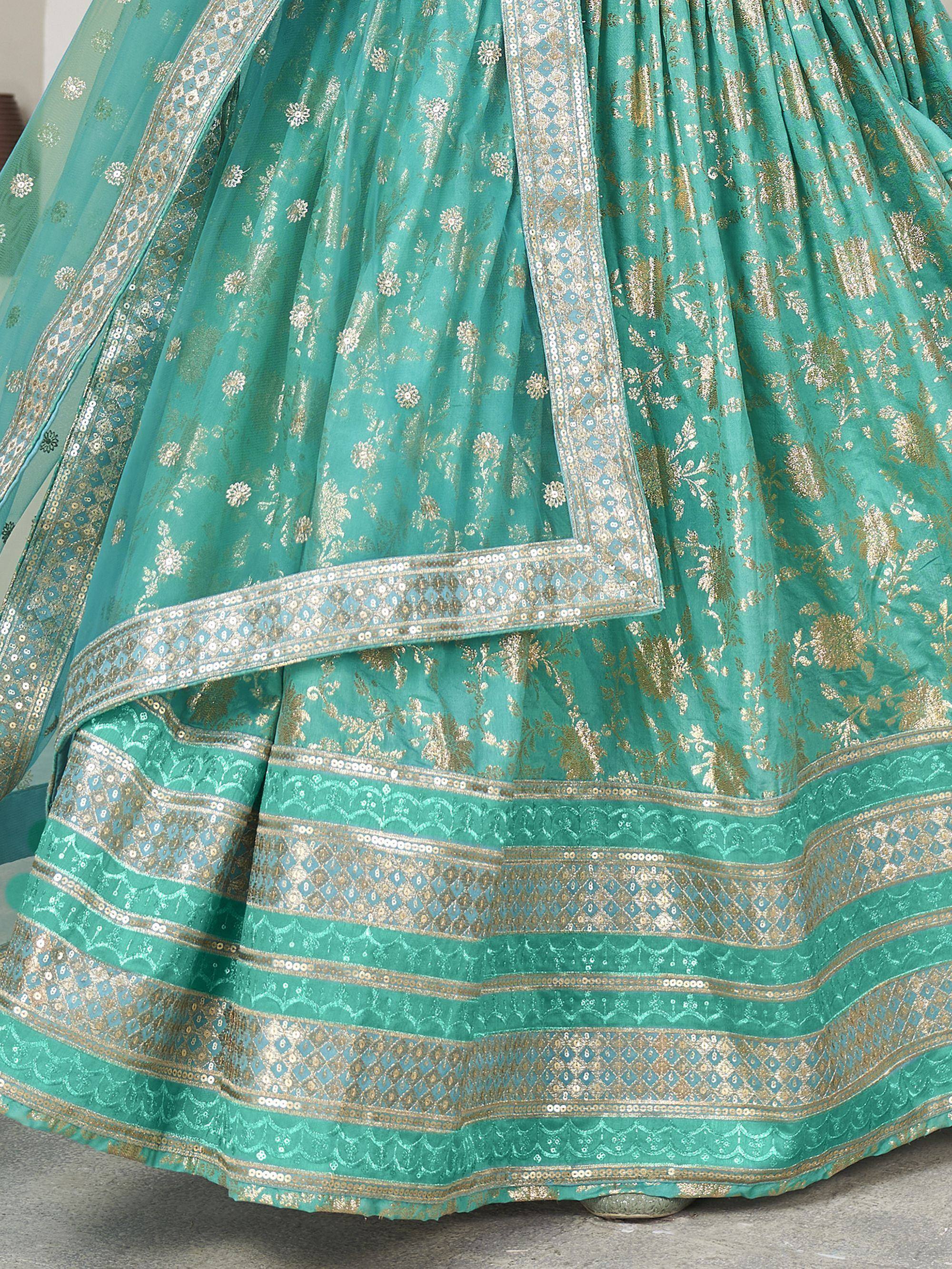 Teal green lehenga with gold floral embroidery and sequin border, ethnic Indian wear