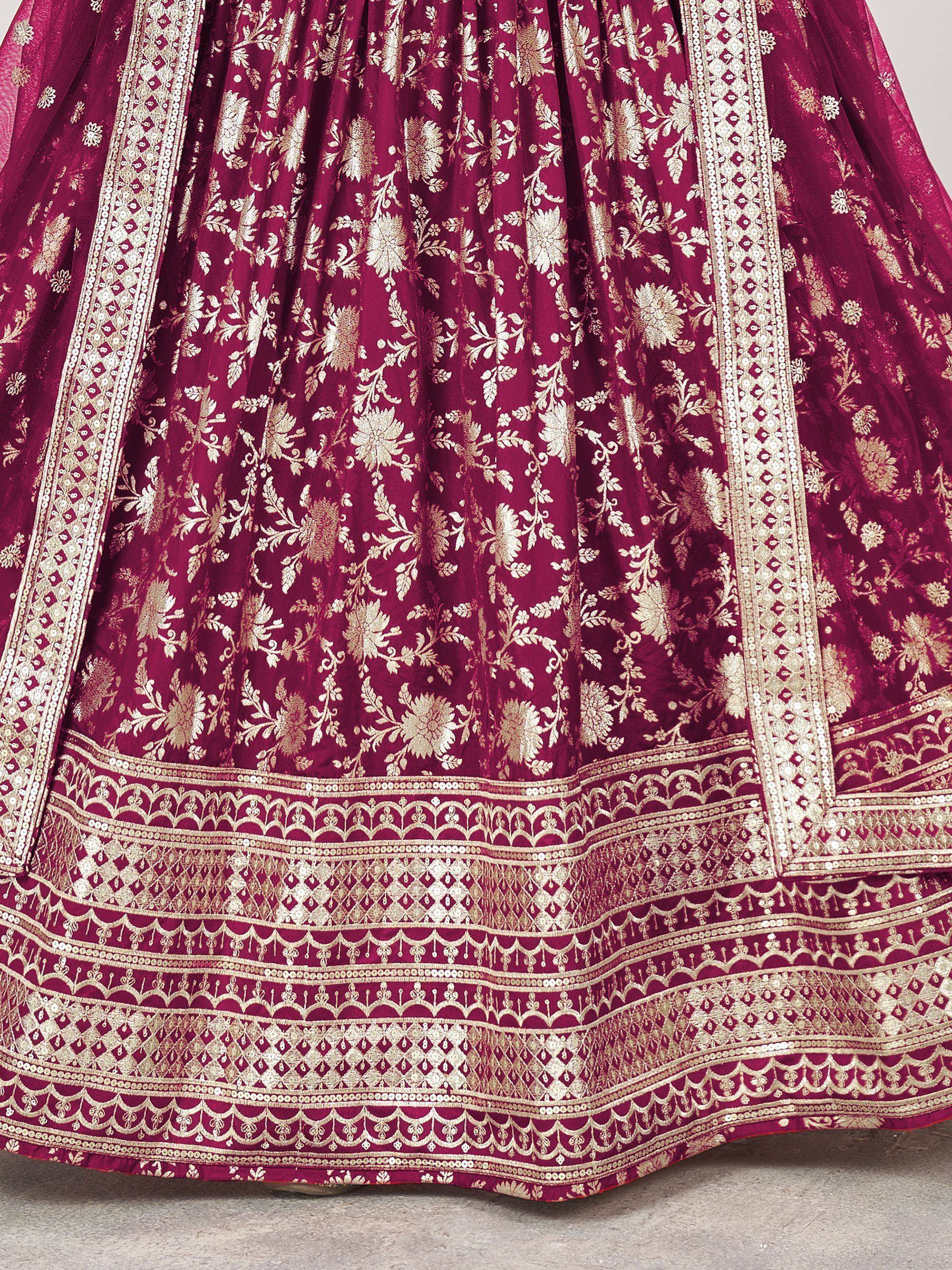 Rich maroon lehenga with intricate gold floral embroidery and detailed border work, perfect for Indian ethnic wear.