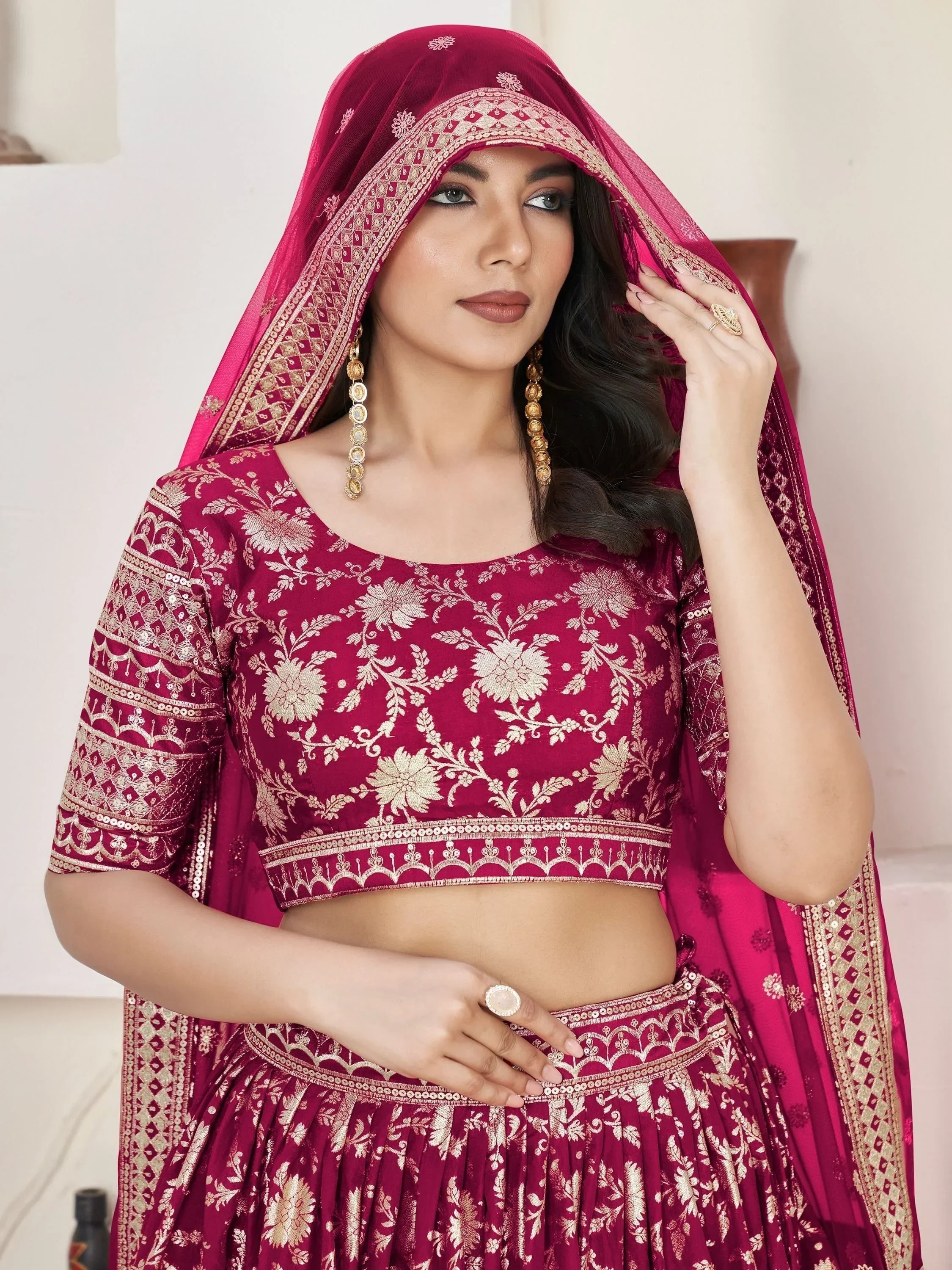 Maroon embroidered lehenga choli with gold floral work and matching dupatta for Indian ethnic wear