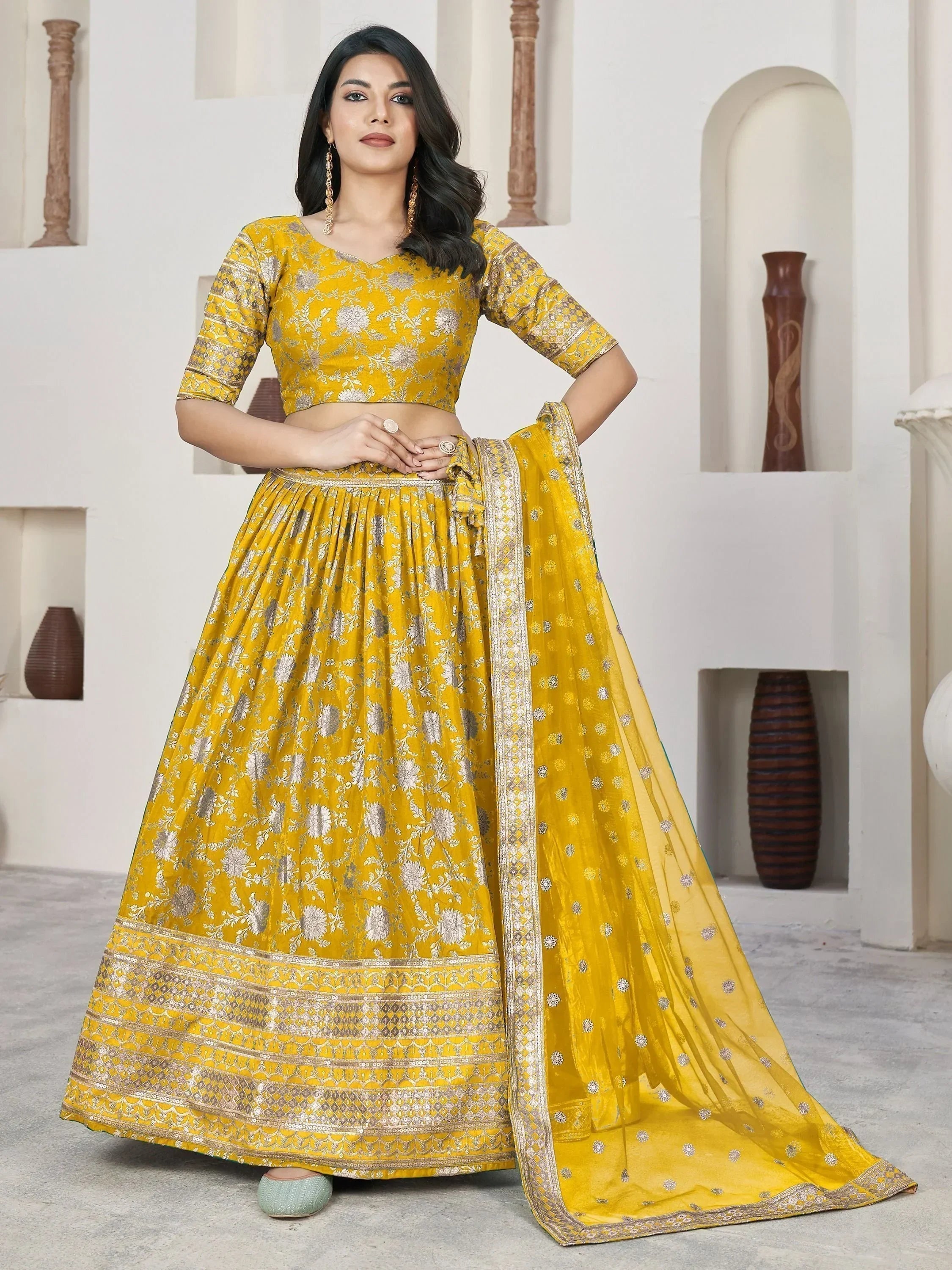 Yellow floral lehenga choli with gold embroidery, perfect for Indian ethnic wear events