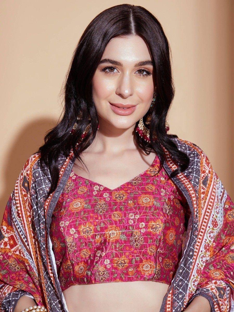 Woman in vibrant floral printed ethnic crop top with matching dupatta, perfect for Indian occasions