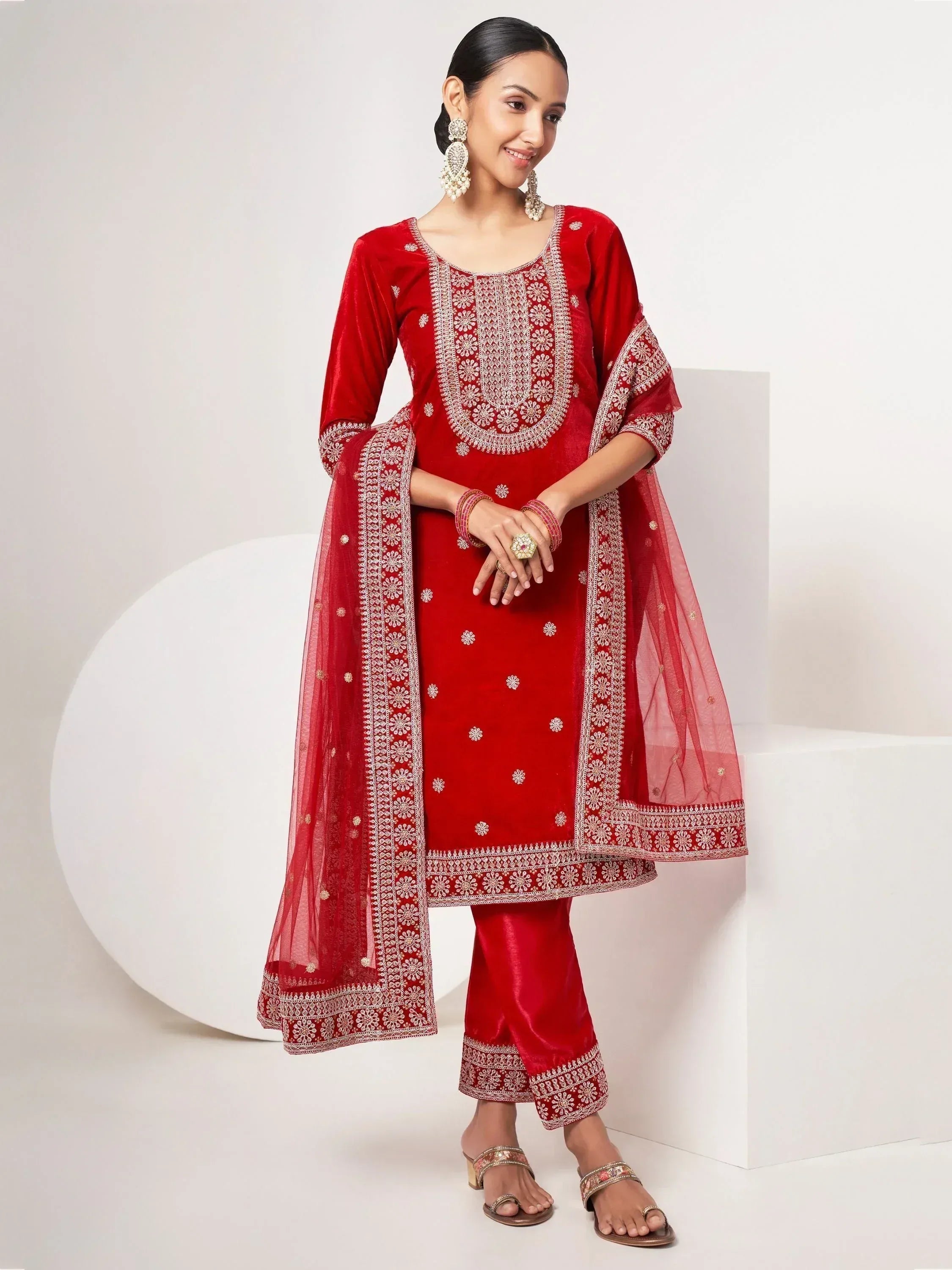 Red velvet salwar kameez with intricate embroidery and matching dupatta for ethnic wear