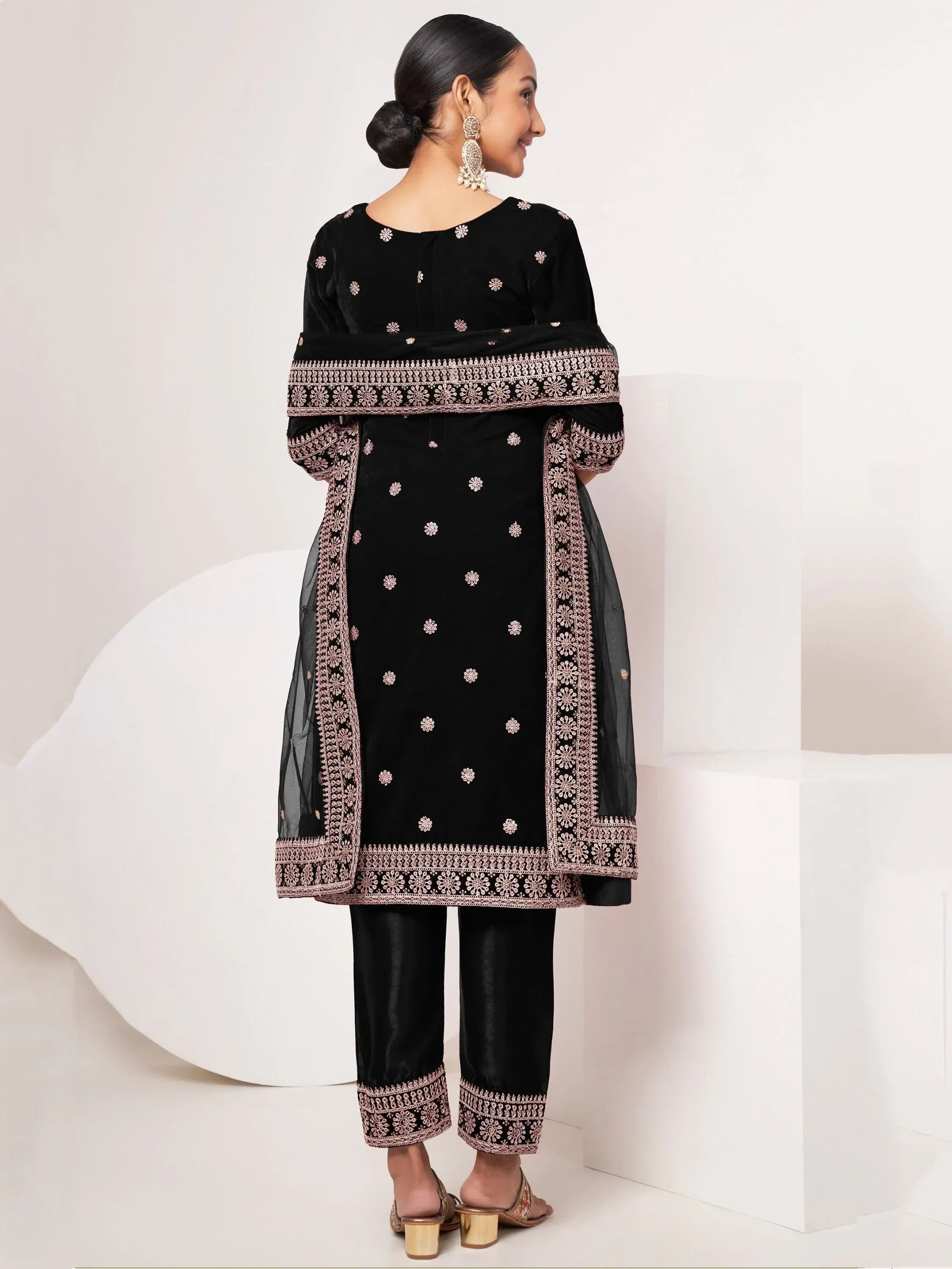 Woman in black embroidered salwar kameez with dupatta, traditional Indian ethnic wear
