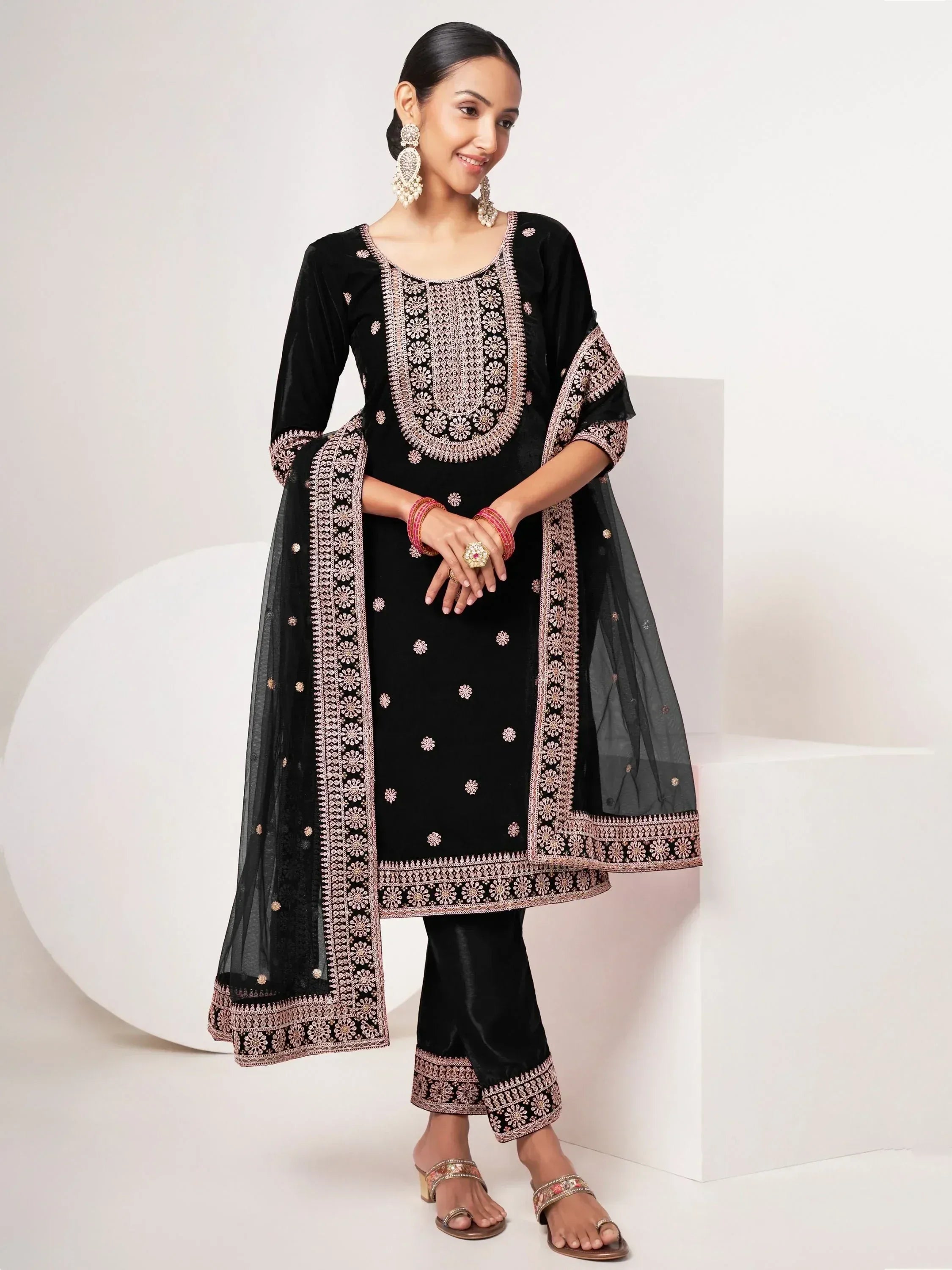 Black embroidered salwar kameez with floral detailing and matching dupatta for ethnic wear