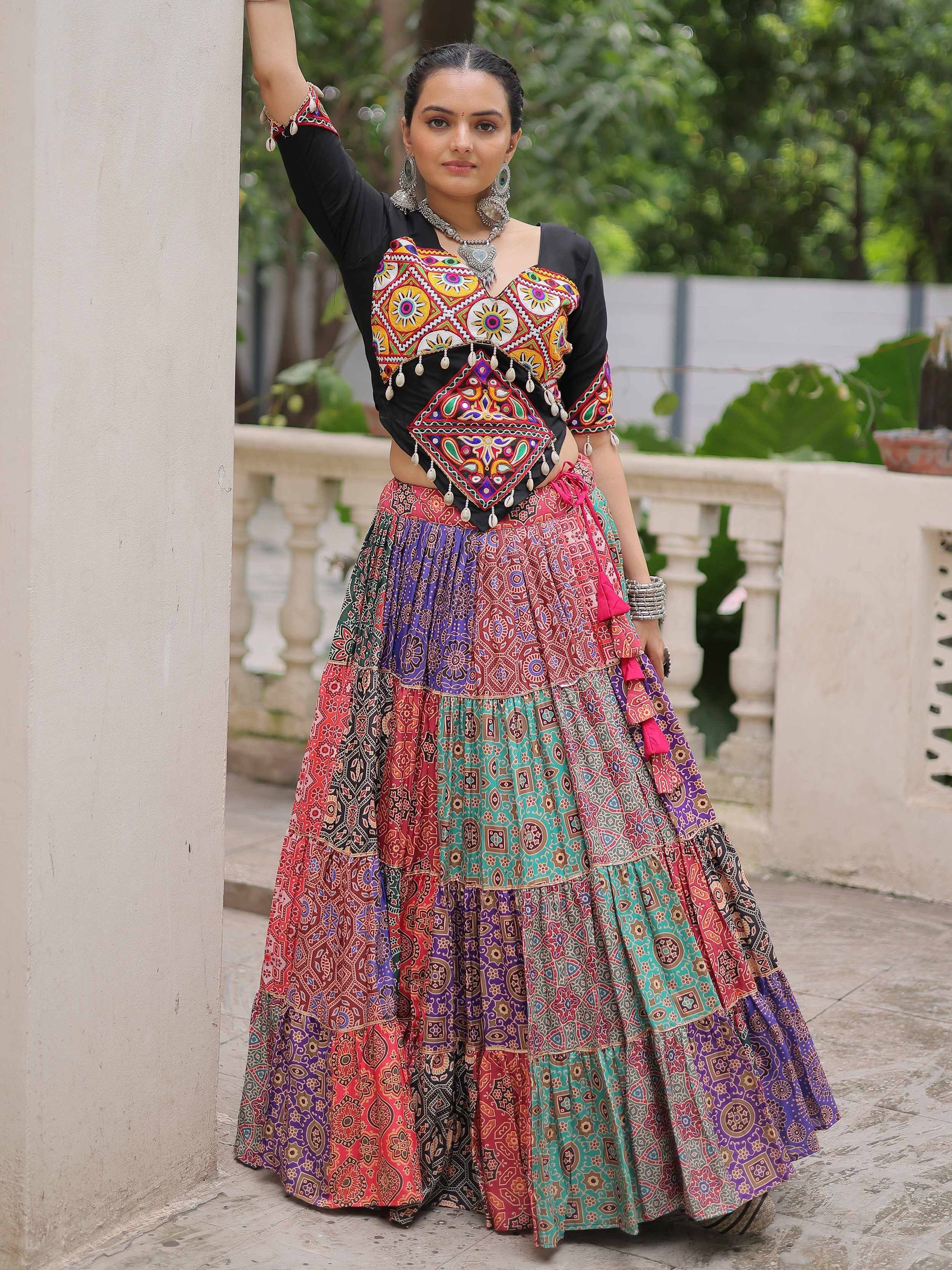 Colorful embroidered ethnic lehenga choli with vibrant patterns and traditional jewelry