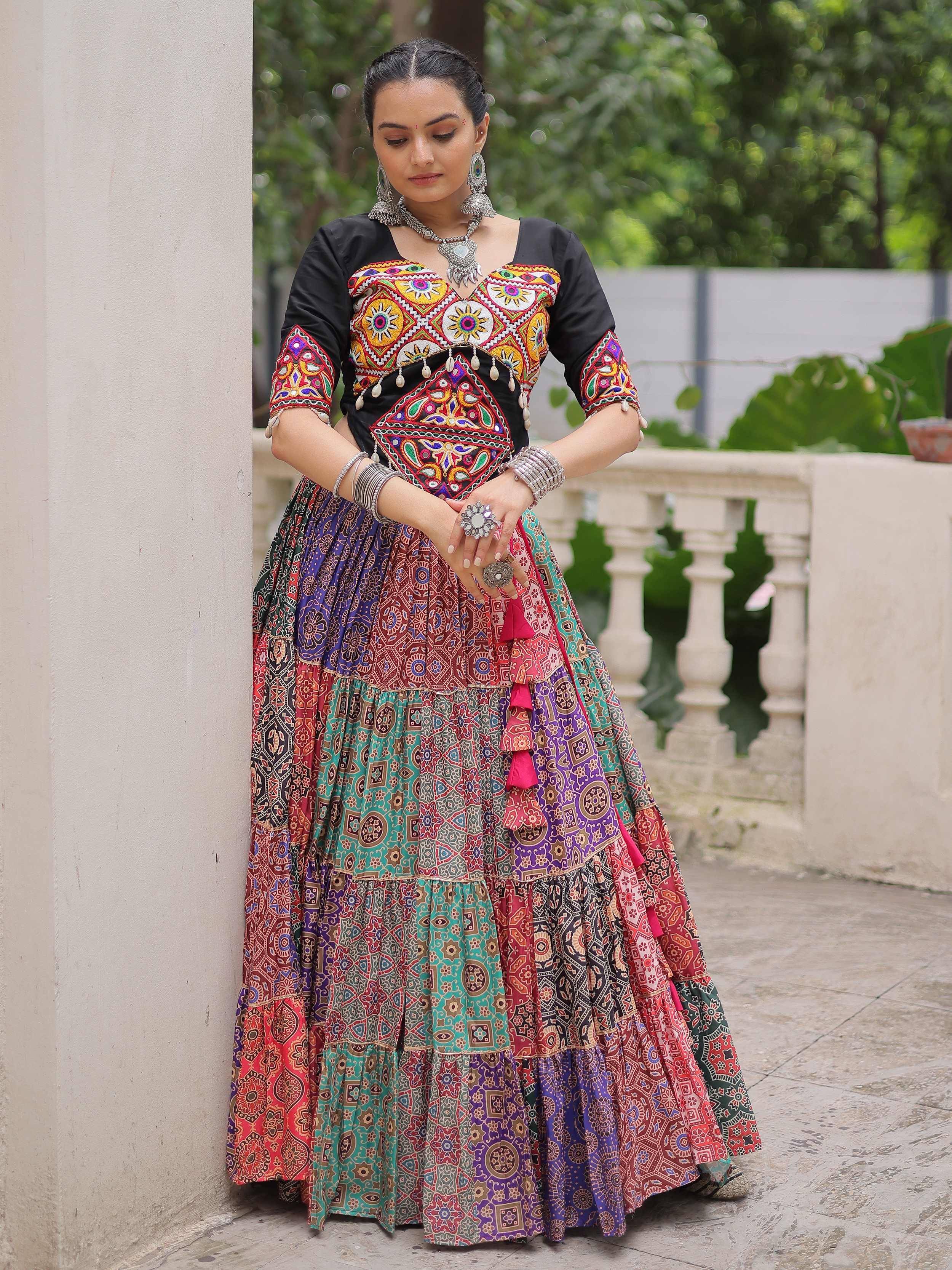Colorful embroidered ethnic lehenga choli with vibrant patterns and traditional jewelry