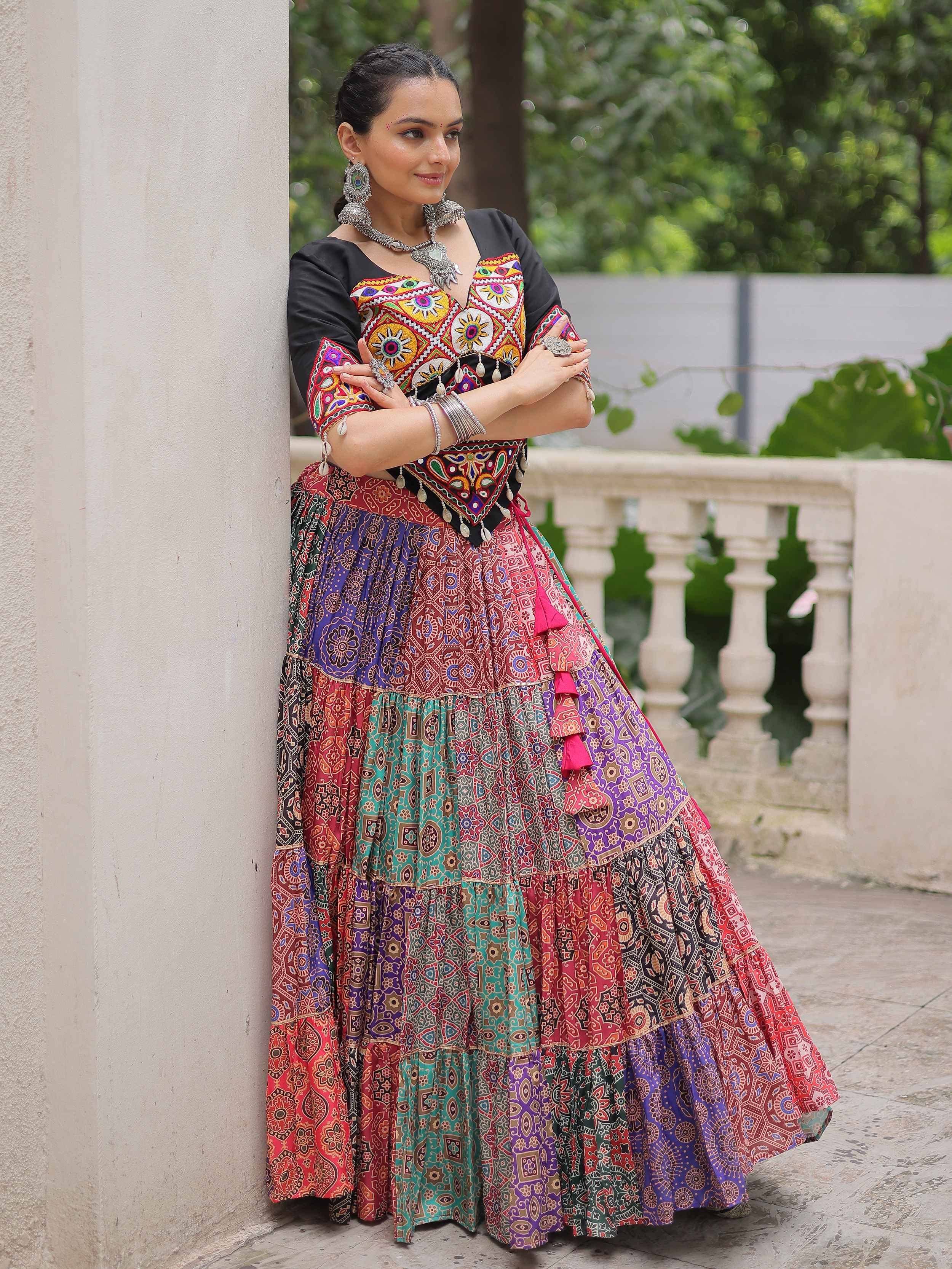 Colorful embroidered ethnic lehenga choli with vibrant patterns and traditional jewelry