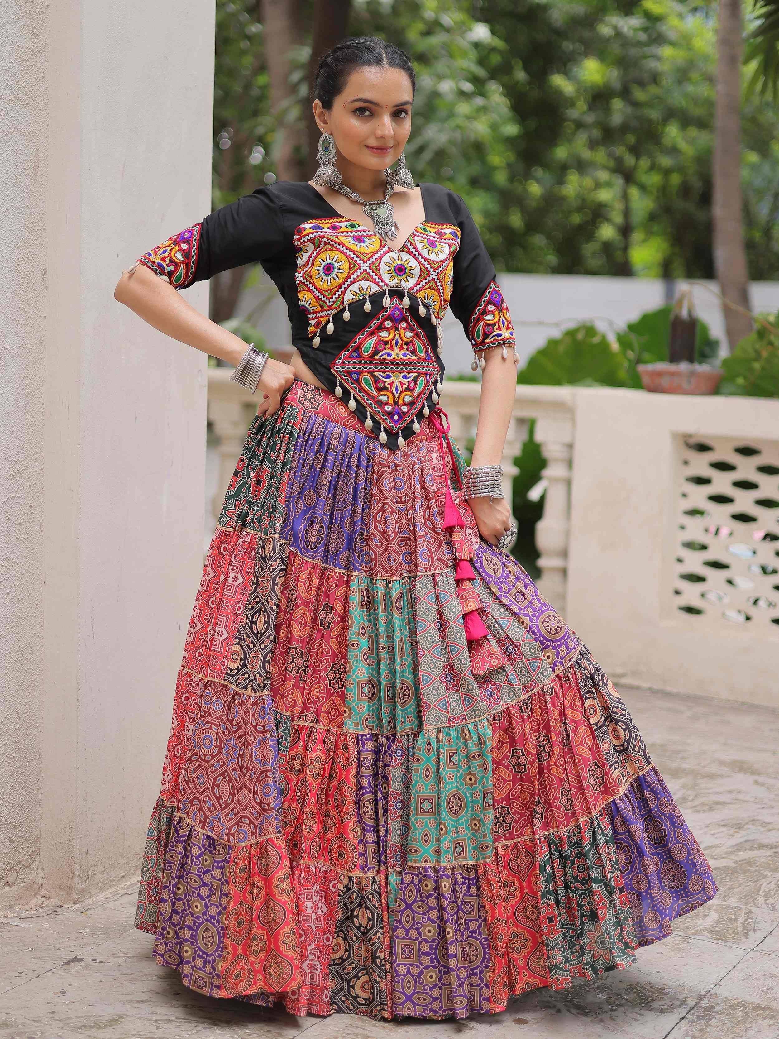 Colorful embroidered Indian ethnic lehenga choli with vibrant patterns and traditional jewelry
