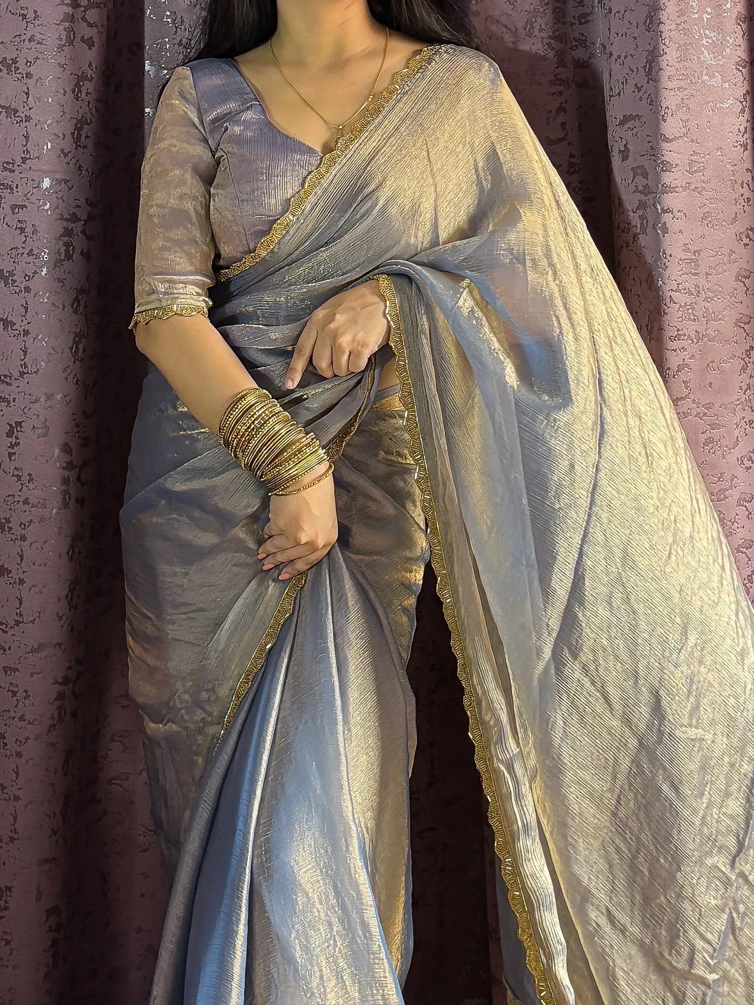 Elegant grey saree with gold border, perfect for Indian ethnic wear and festive occasions.