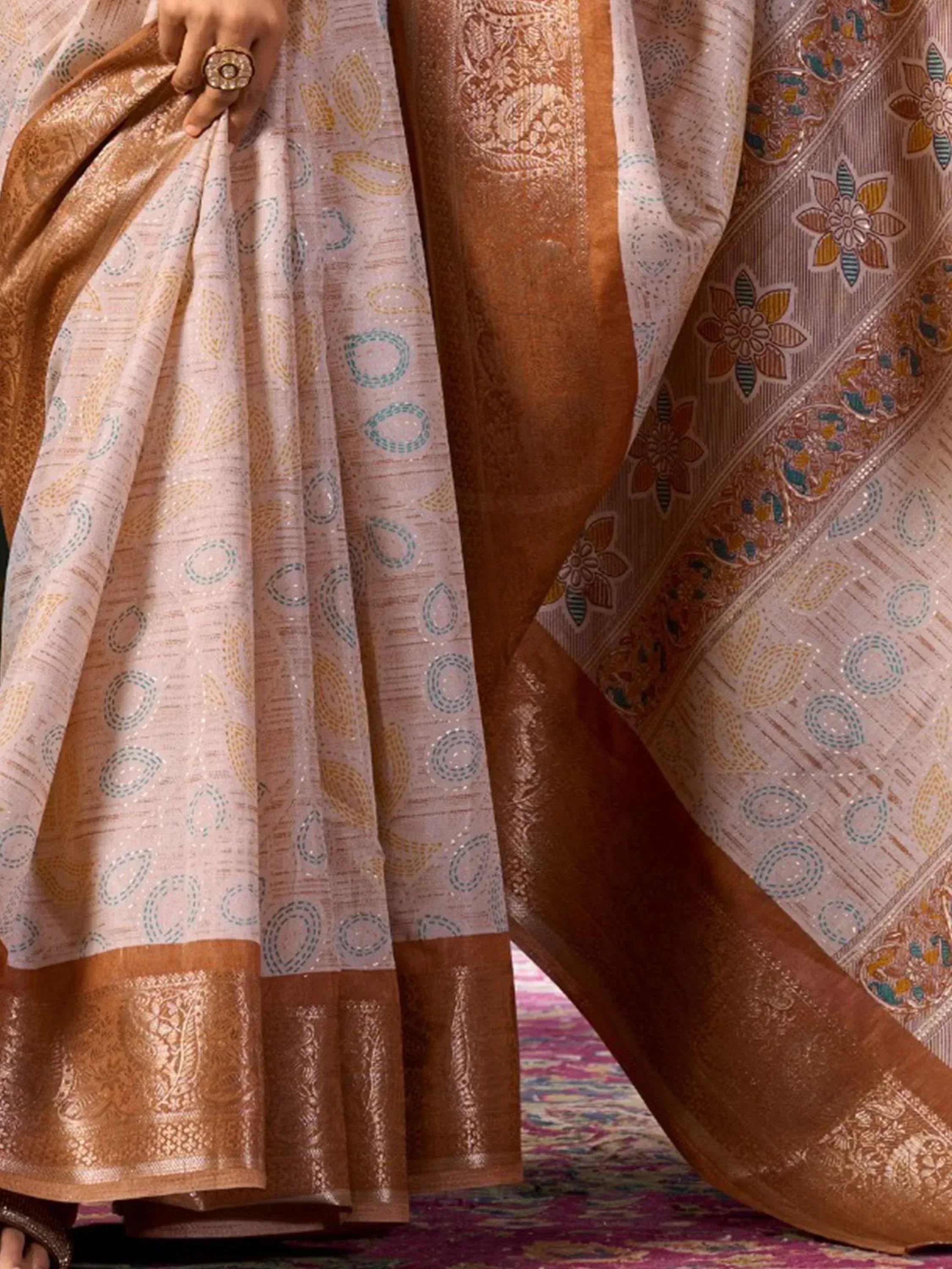 Elegant Indian saree with gold and teal floral motifs, rich border, perfect for ethnic occasions