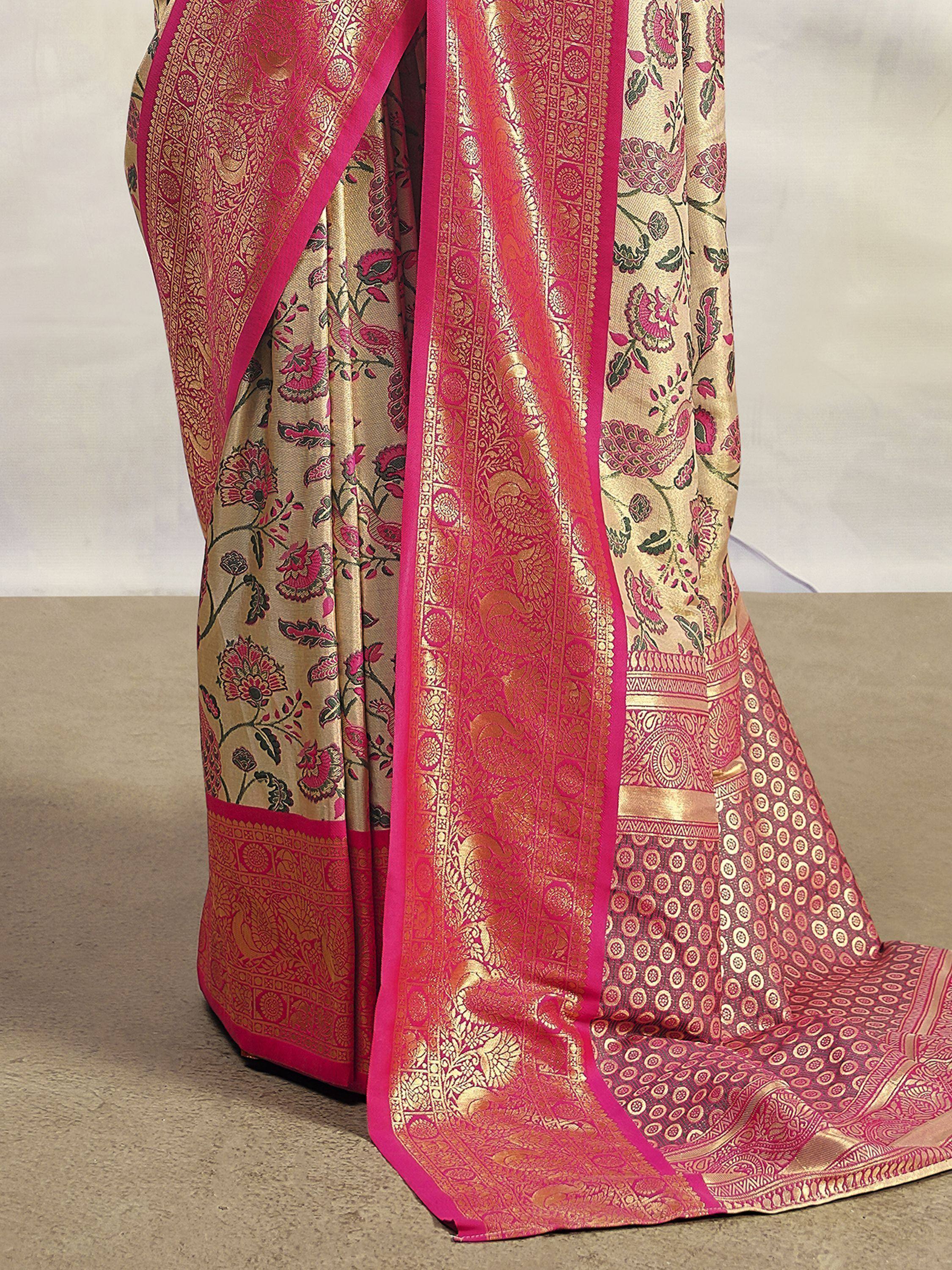 Elegant pink and gold floral saree with intricate zari work, perfect for Indian ethnic occasions
