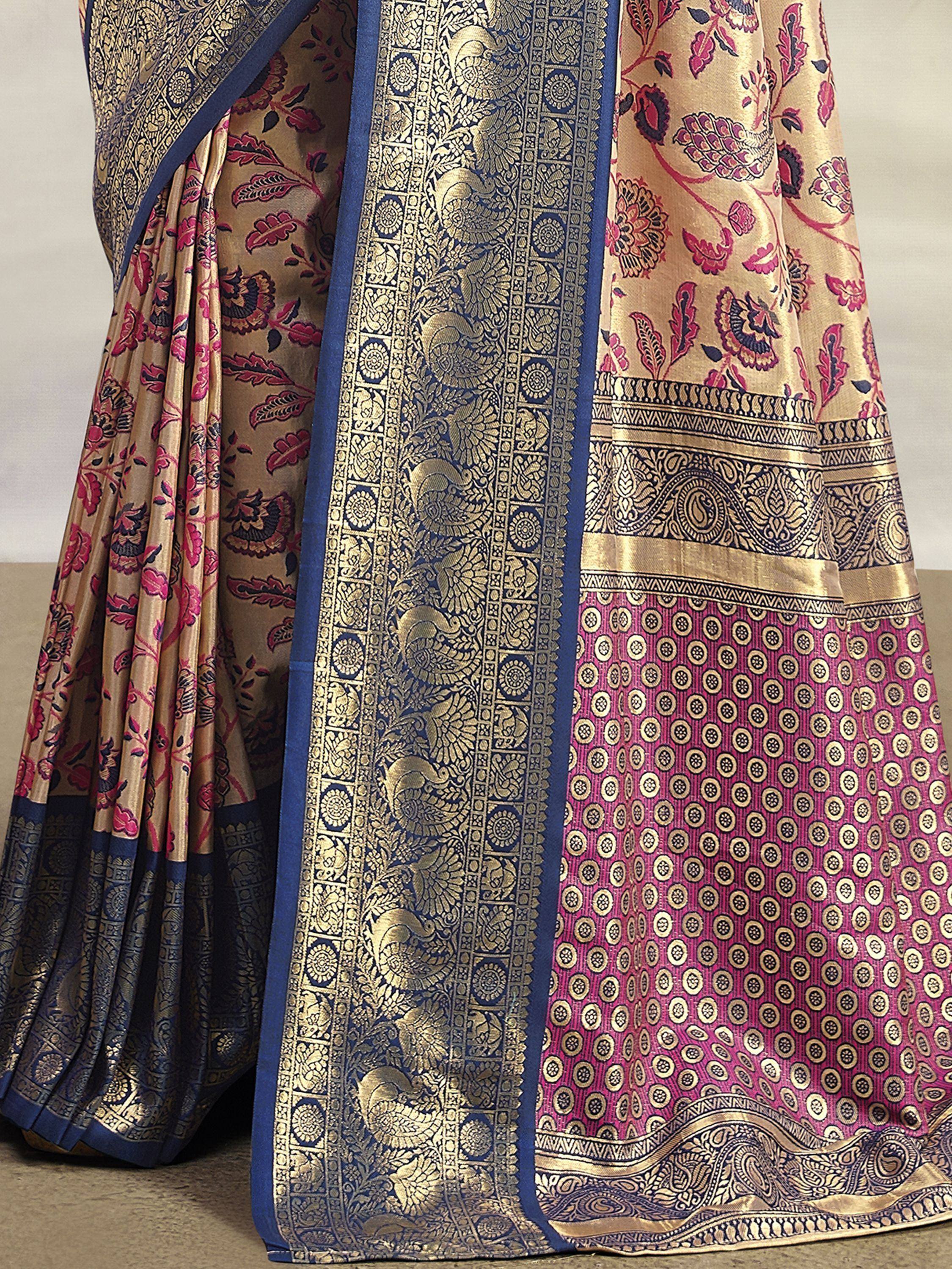 Luxury Indian saree with gold floral and paisley brocade, navy blue border, pink patterned pallu, perfect for weddings.