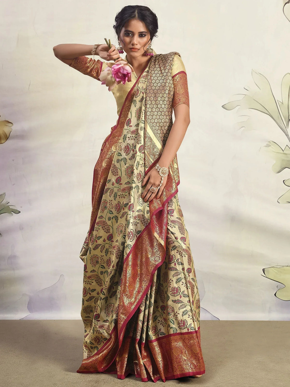 Elegant Indian saree with floral and paisley print, gold and maroon border, perfect for ethnic occasions
