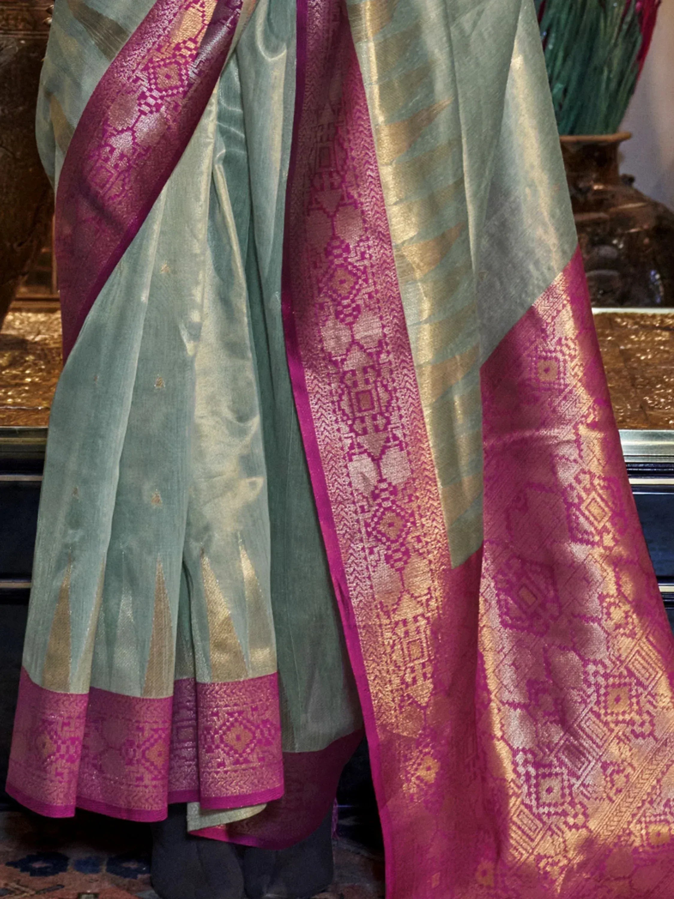 Elegant green and magenta silk saree with gold zari border, perfect for Indian ethnic wear occasions