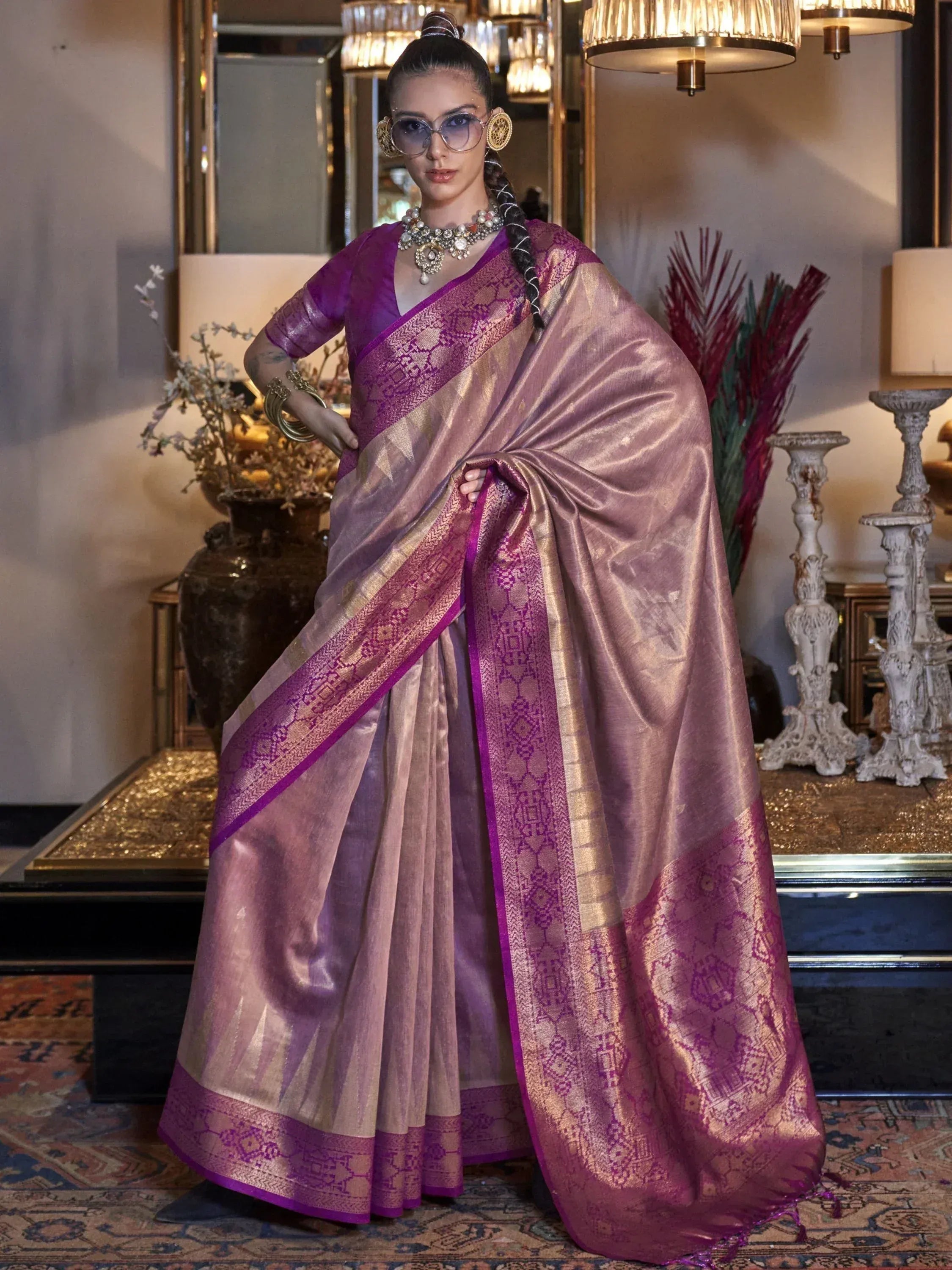 Elegant purple and gold designer saree with intricate woven patterns, perfect for Indian ethnic occasions