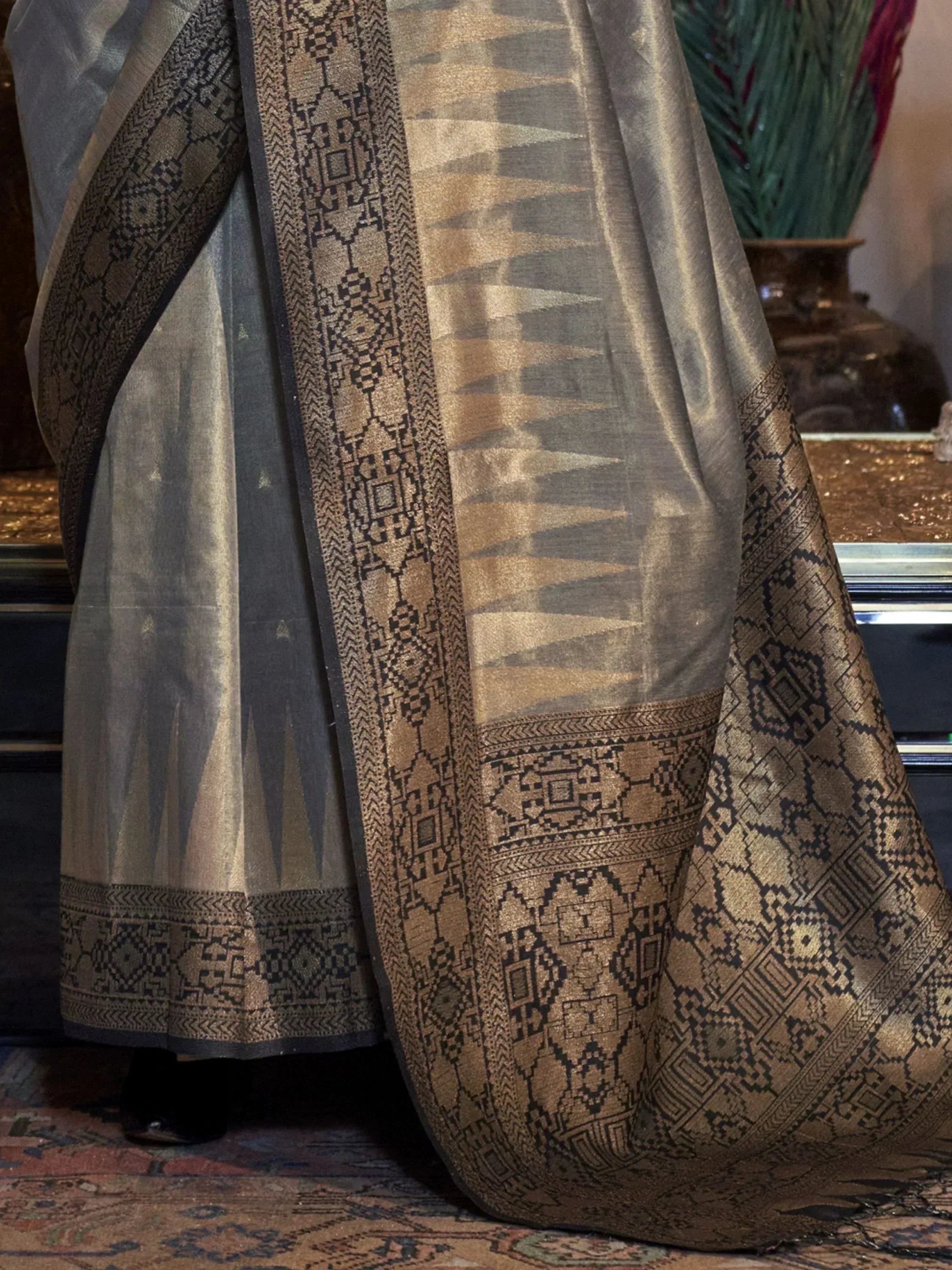 Elegant grey and gold ethnic saree with intricate geometric border, perfect for Indian occasions