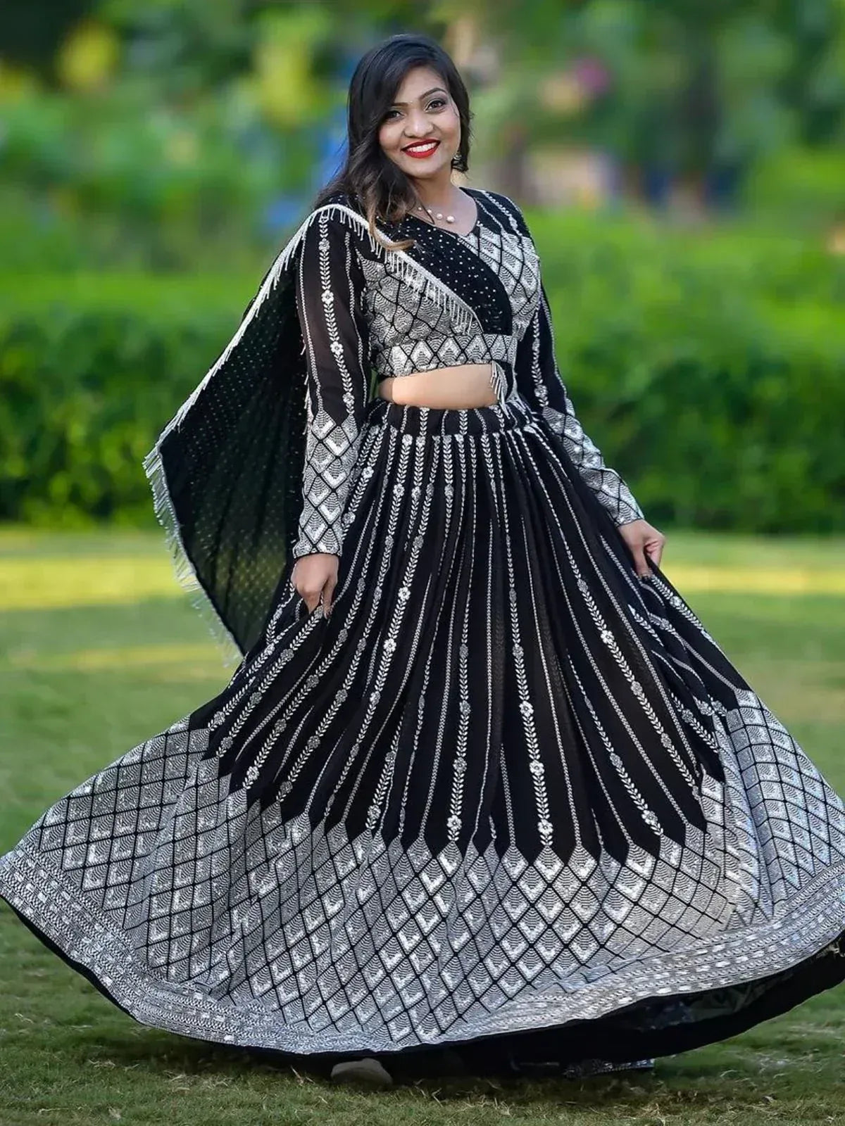 Black and silver embroidered lehenga choli with flared skirt and cape, perfect for Indian ethnic wear occasions