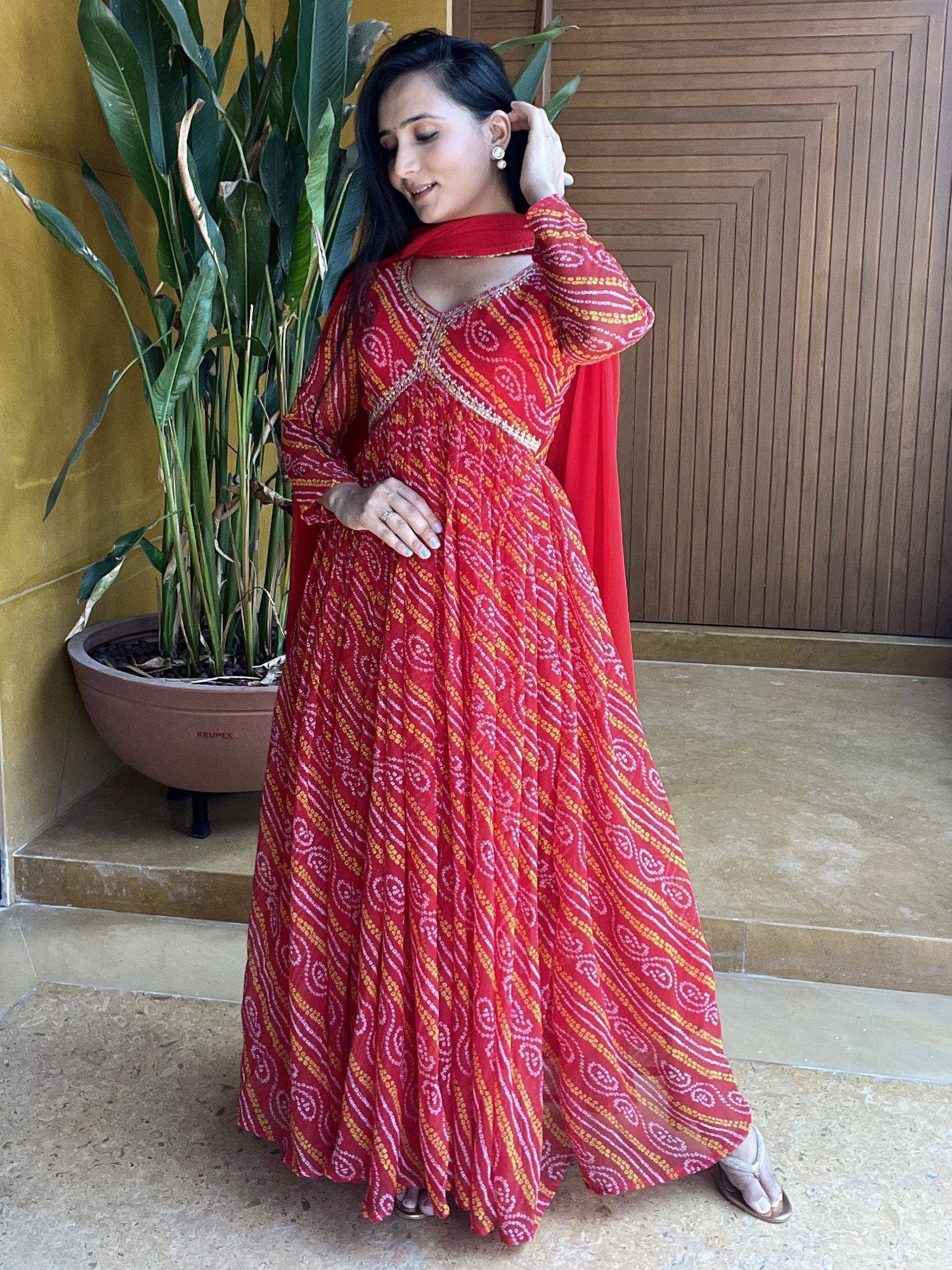 Red printed ethnic gown with matching dupatta, perfect for Indian occasions and festive wear.