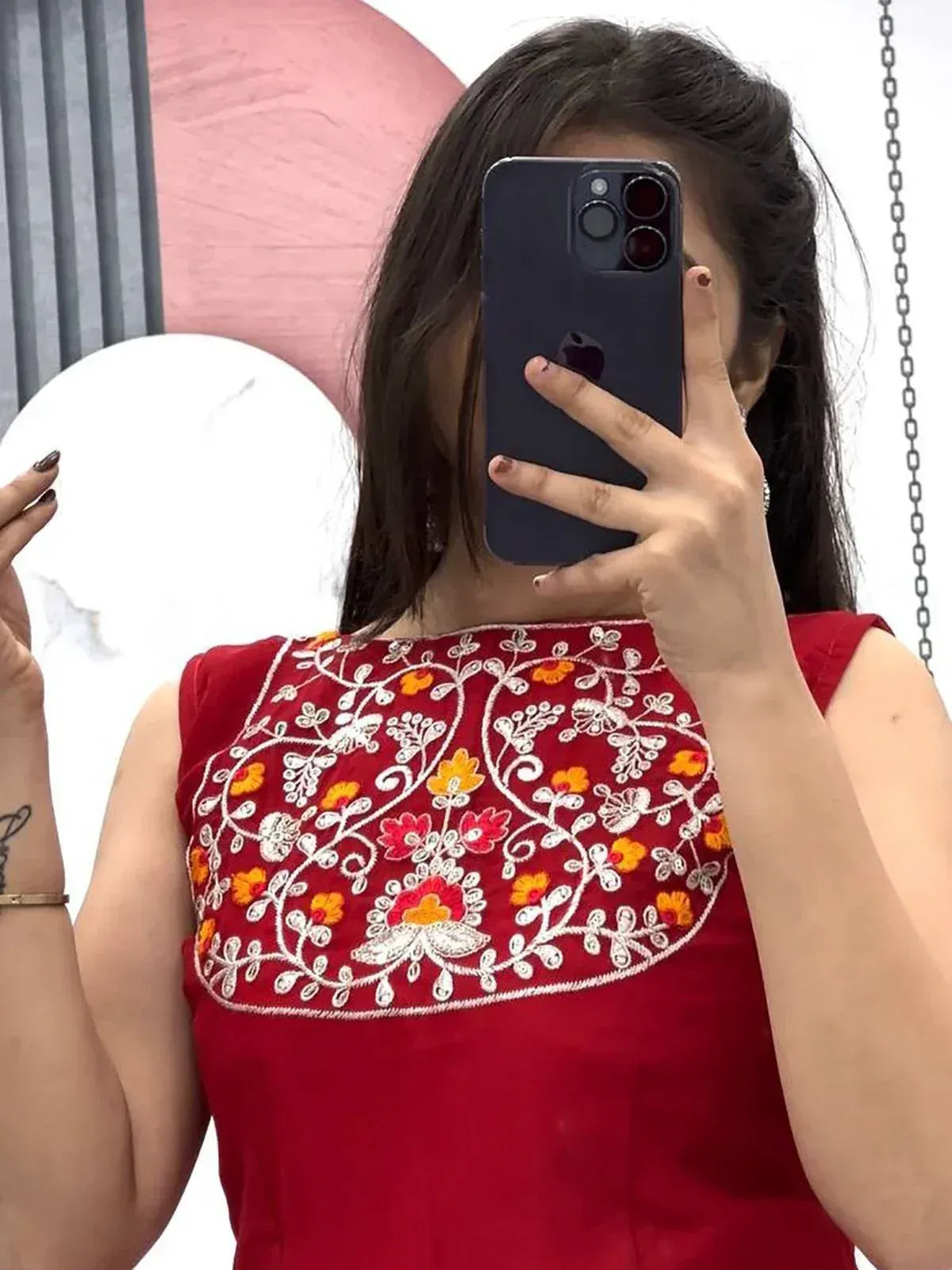Red sleeveless top with floral embroidery, perfect for ethnic wear and festive occasions