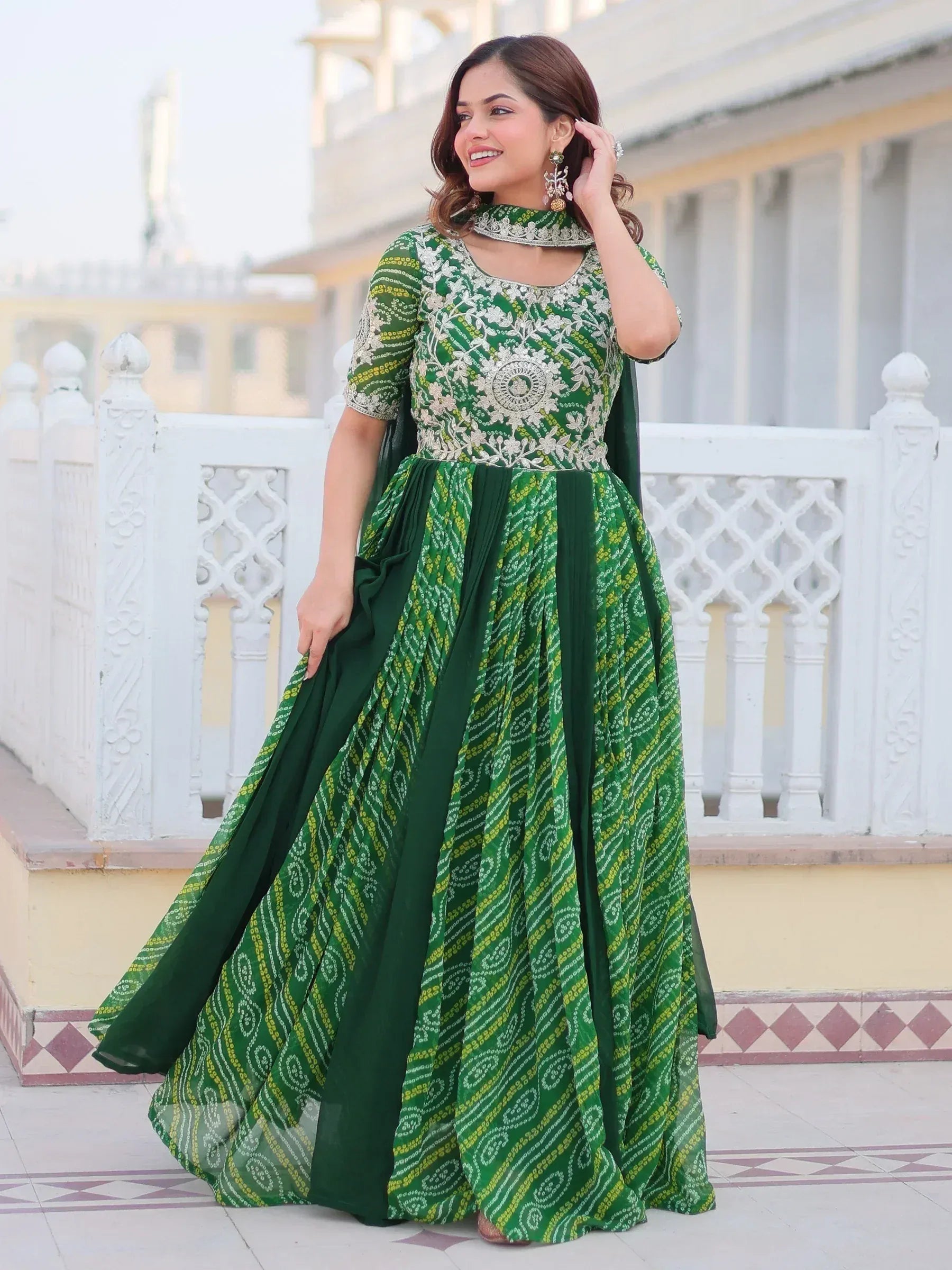 Green embroidered ethnic gown with floral patterns and choker neckline