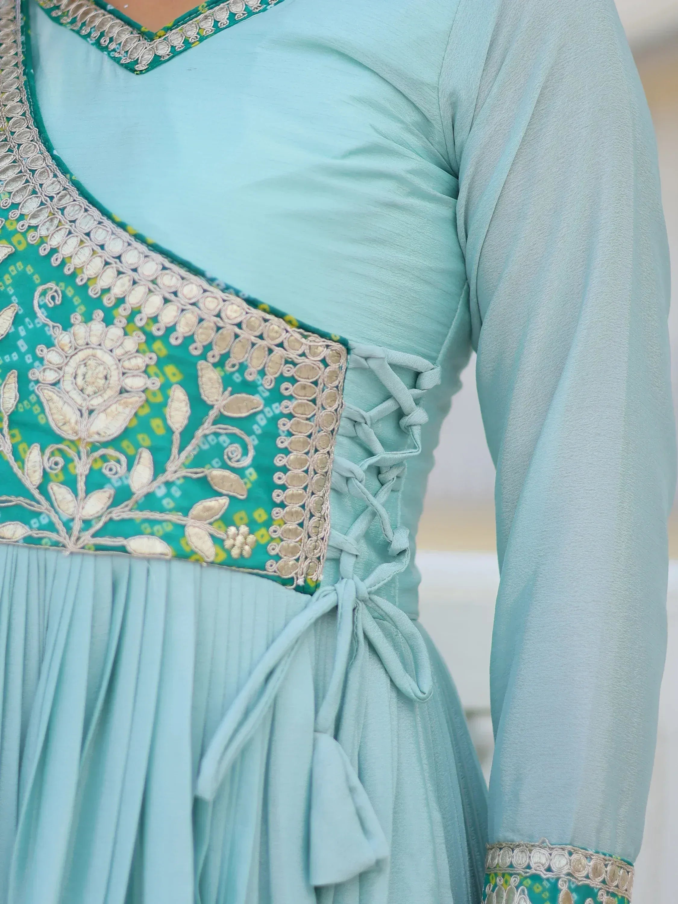 Light blue ethnic gown with floral embroidery and lace-up back detail