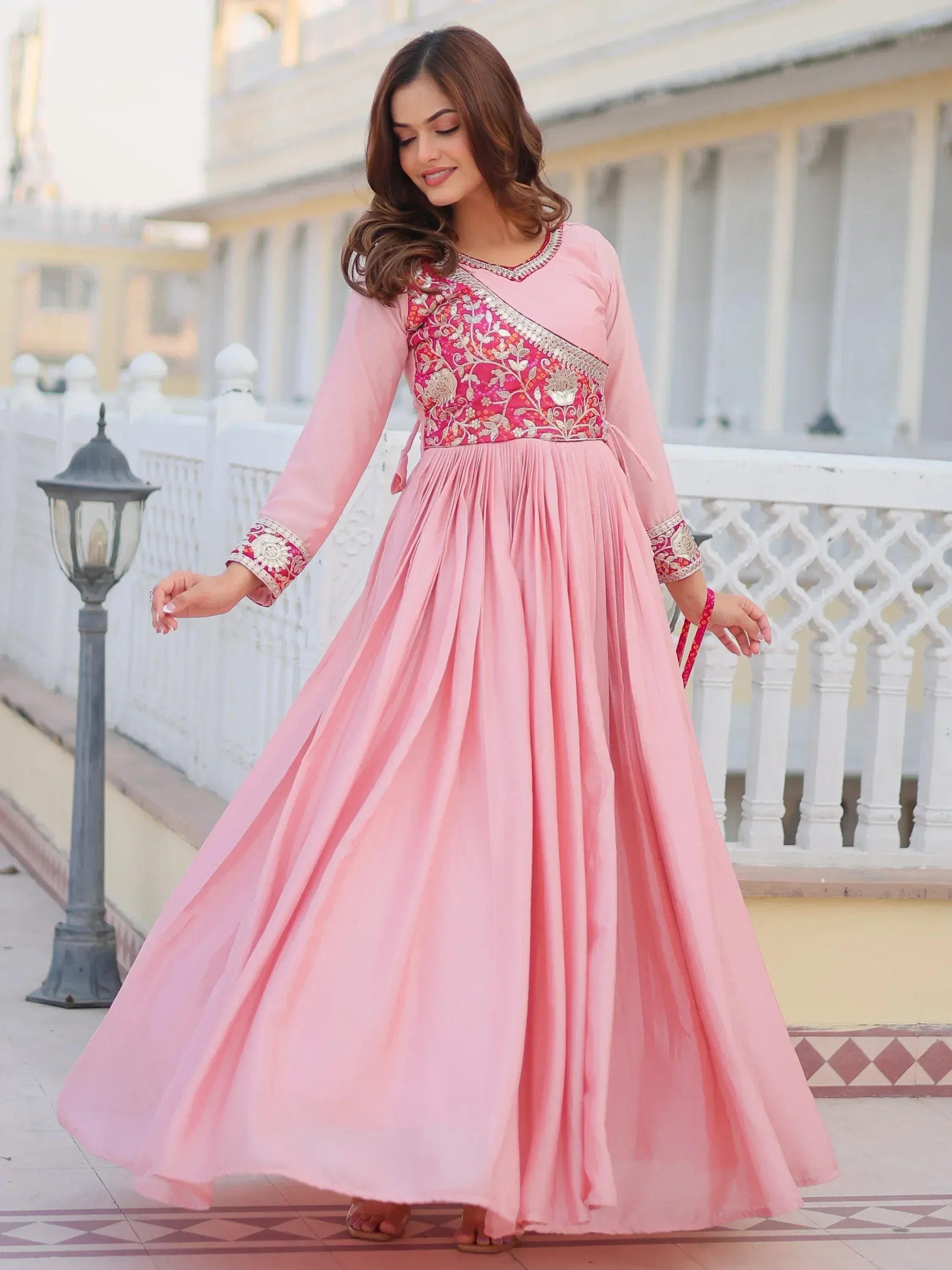 Pink ethnic gown with floral embroidery, perfect for Indian celebrations and festive occasions.